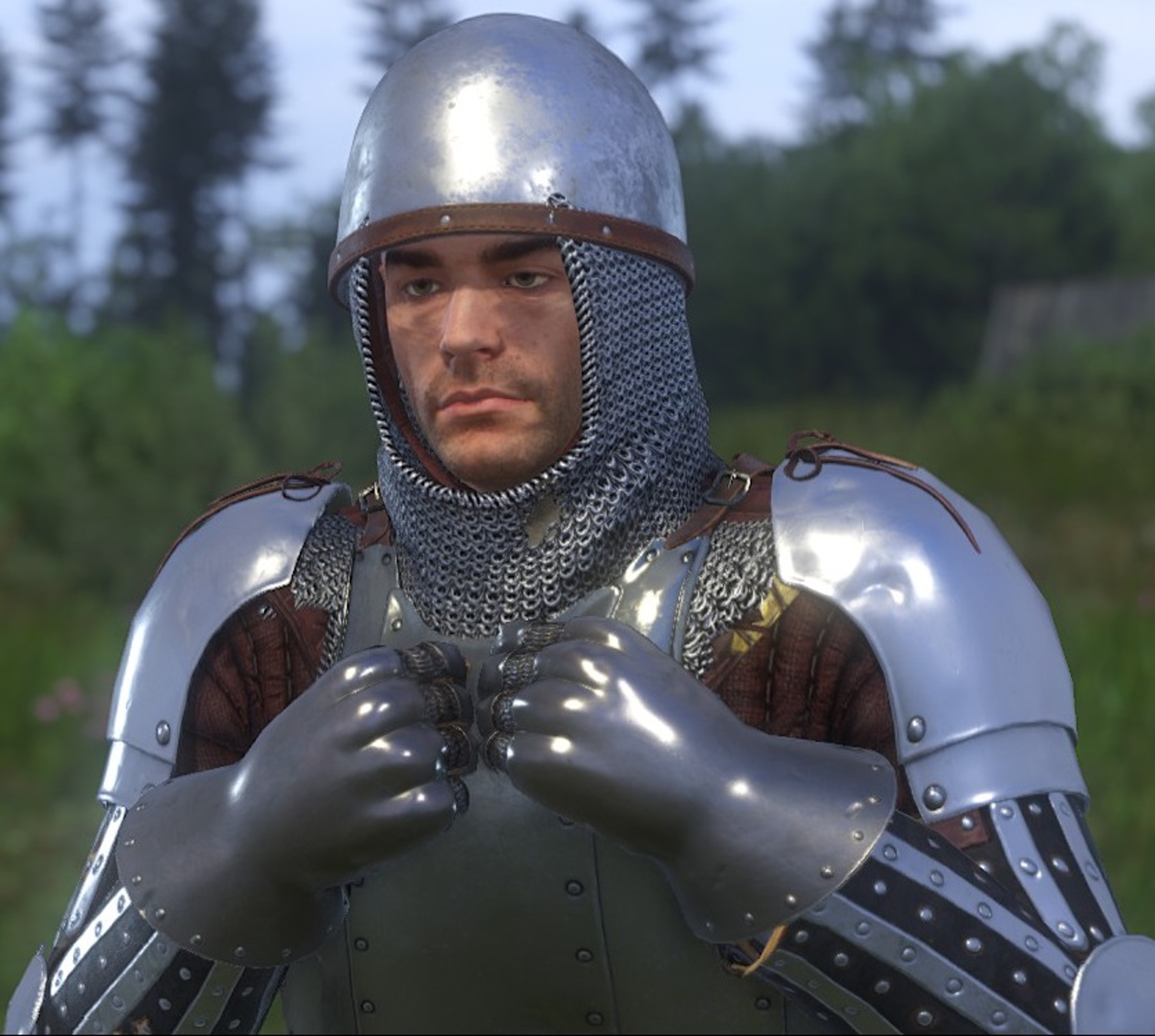 A medieval knight in full armor standing in a forest
