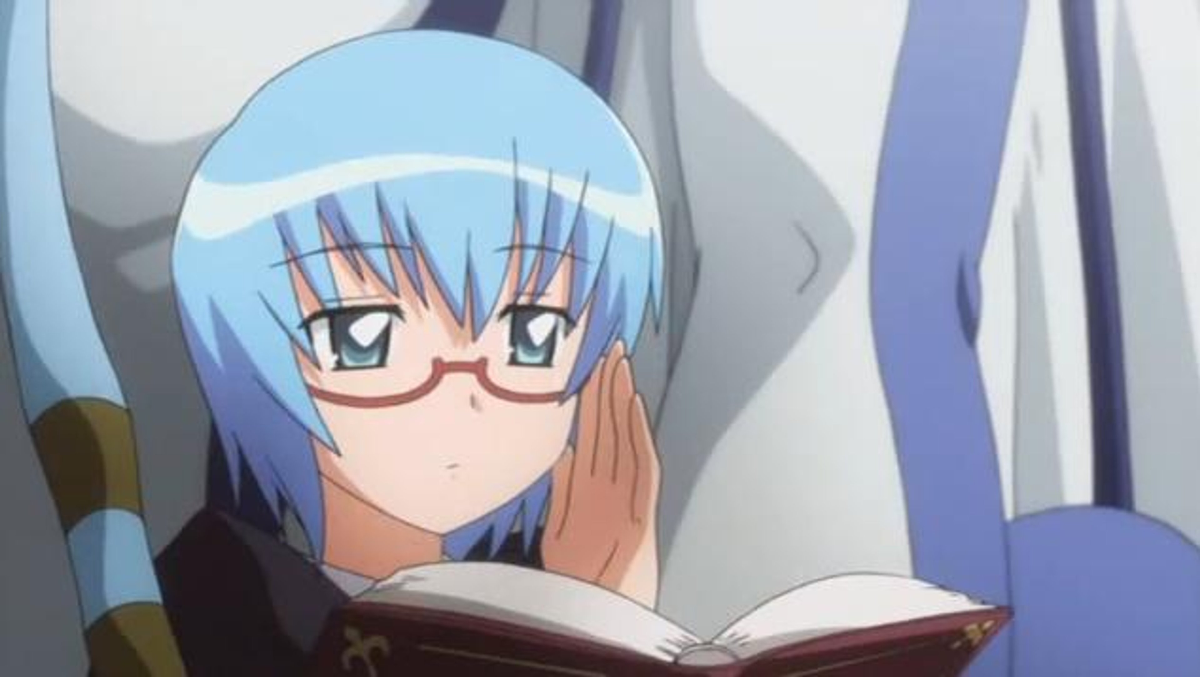 A young, blue-haired girl with glasses reading a book
