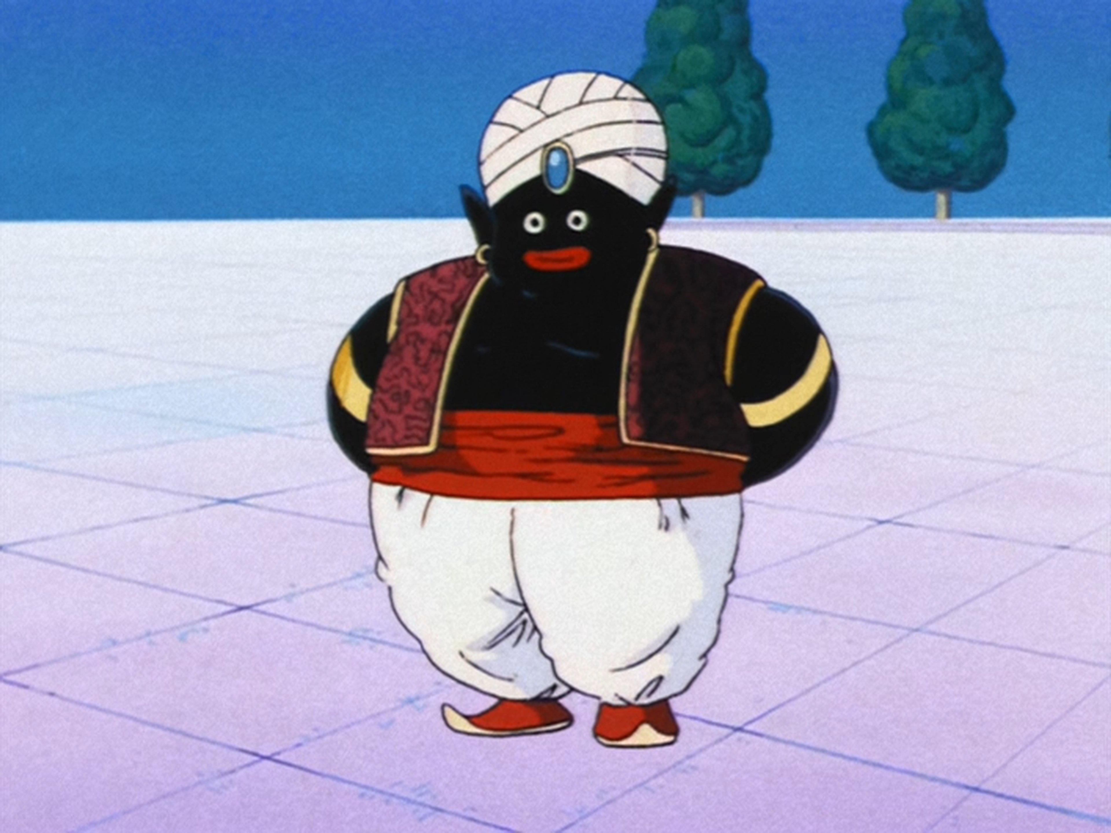 A short, plump humanoid character with a dark complexion, pointy ears, and no nose, wearing a turban-like headpiece, a red vest, and loose white pants, standing in a garden-like setting.