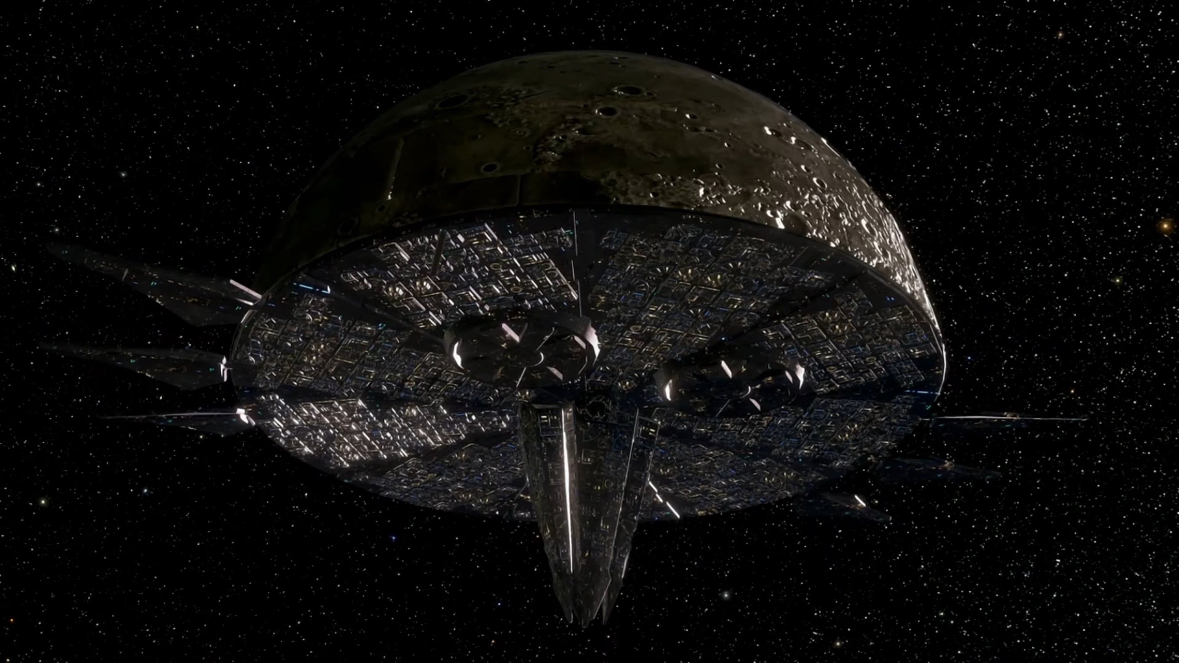 A large, spherical space station orbiting Earth, with a face-like exterior and the Eclipse Cannon protruding from its nose.