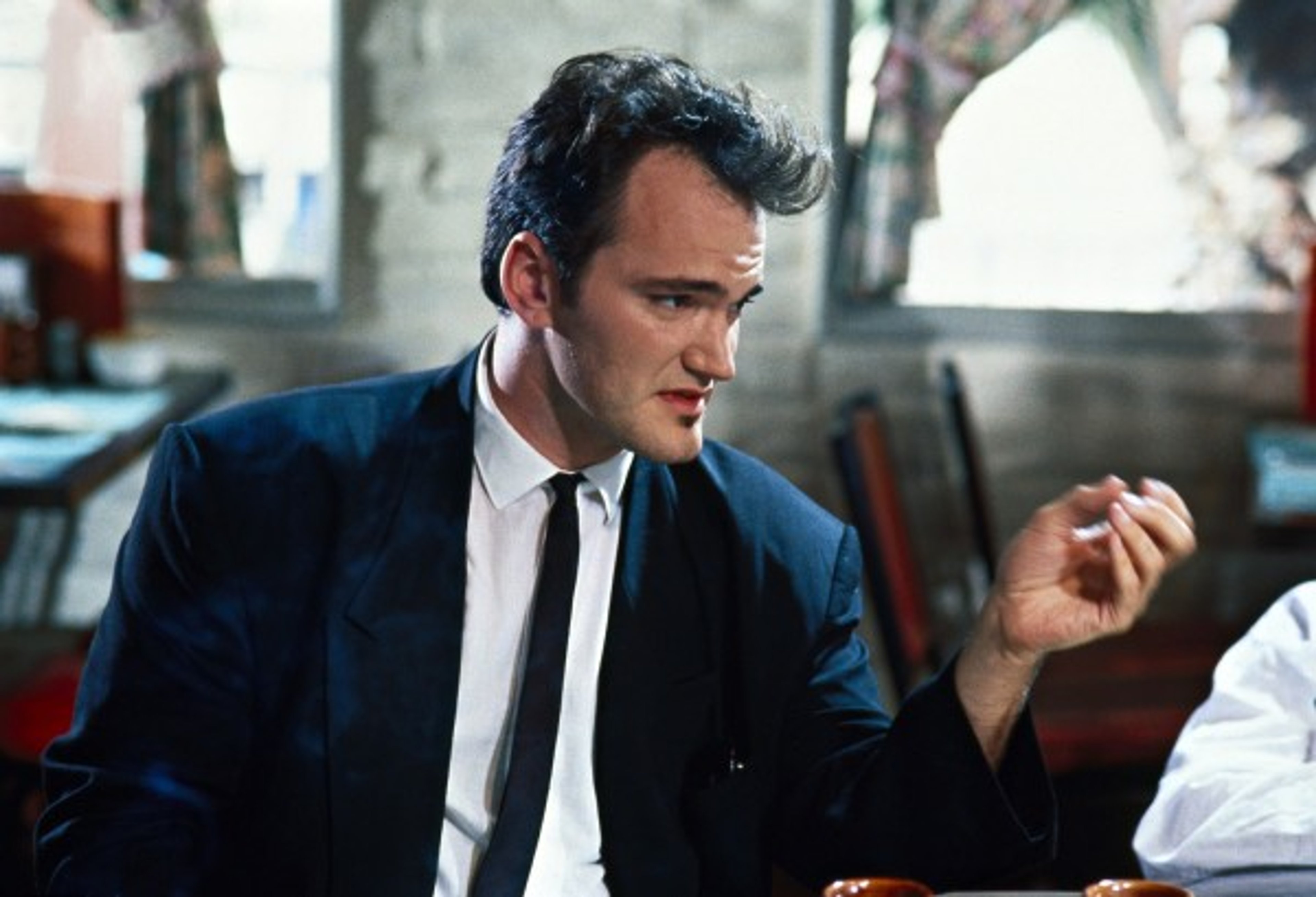 A man in a suit with a serious expression