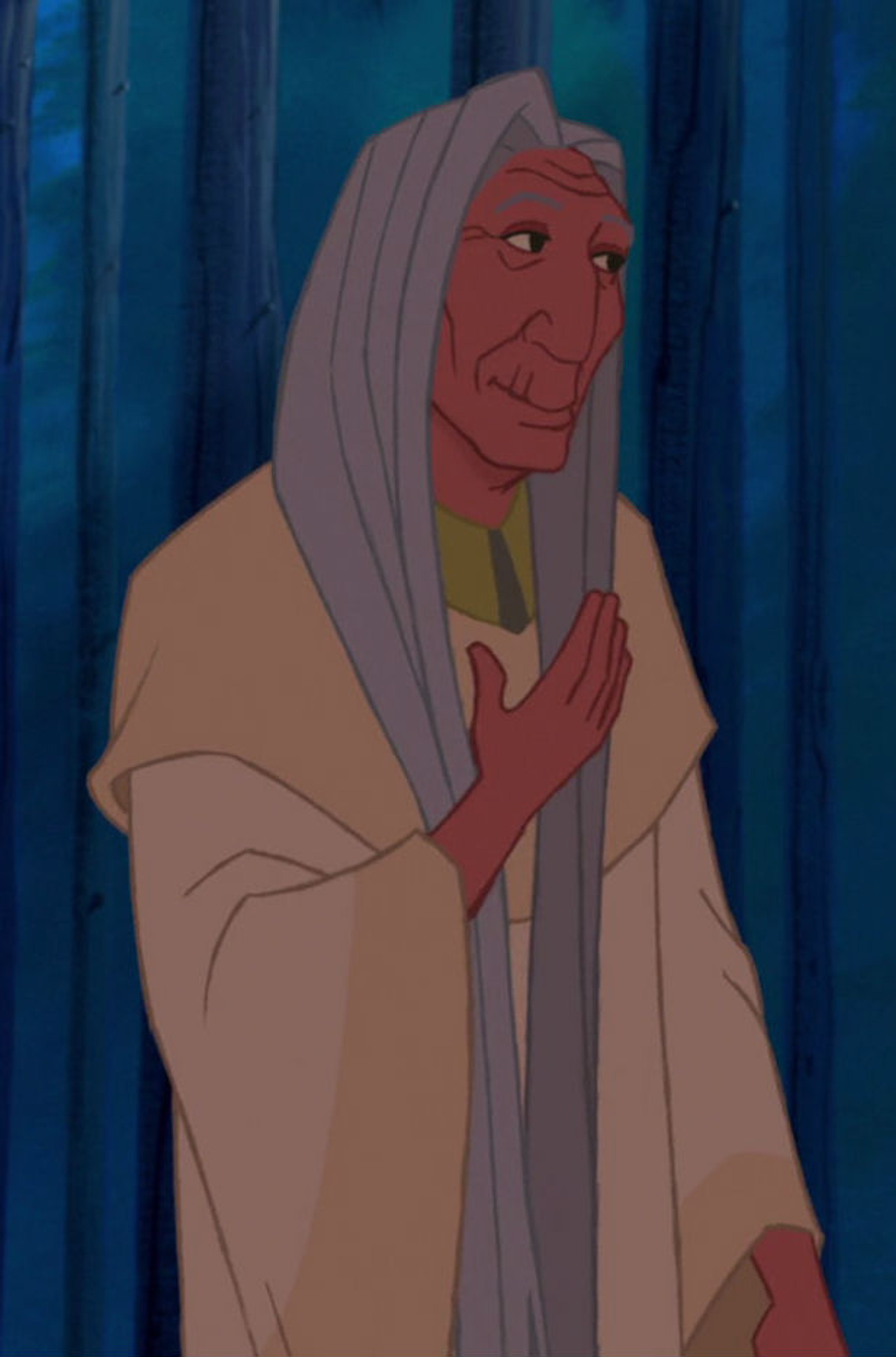 An elderly Native American shaman in a contemplative pose