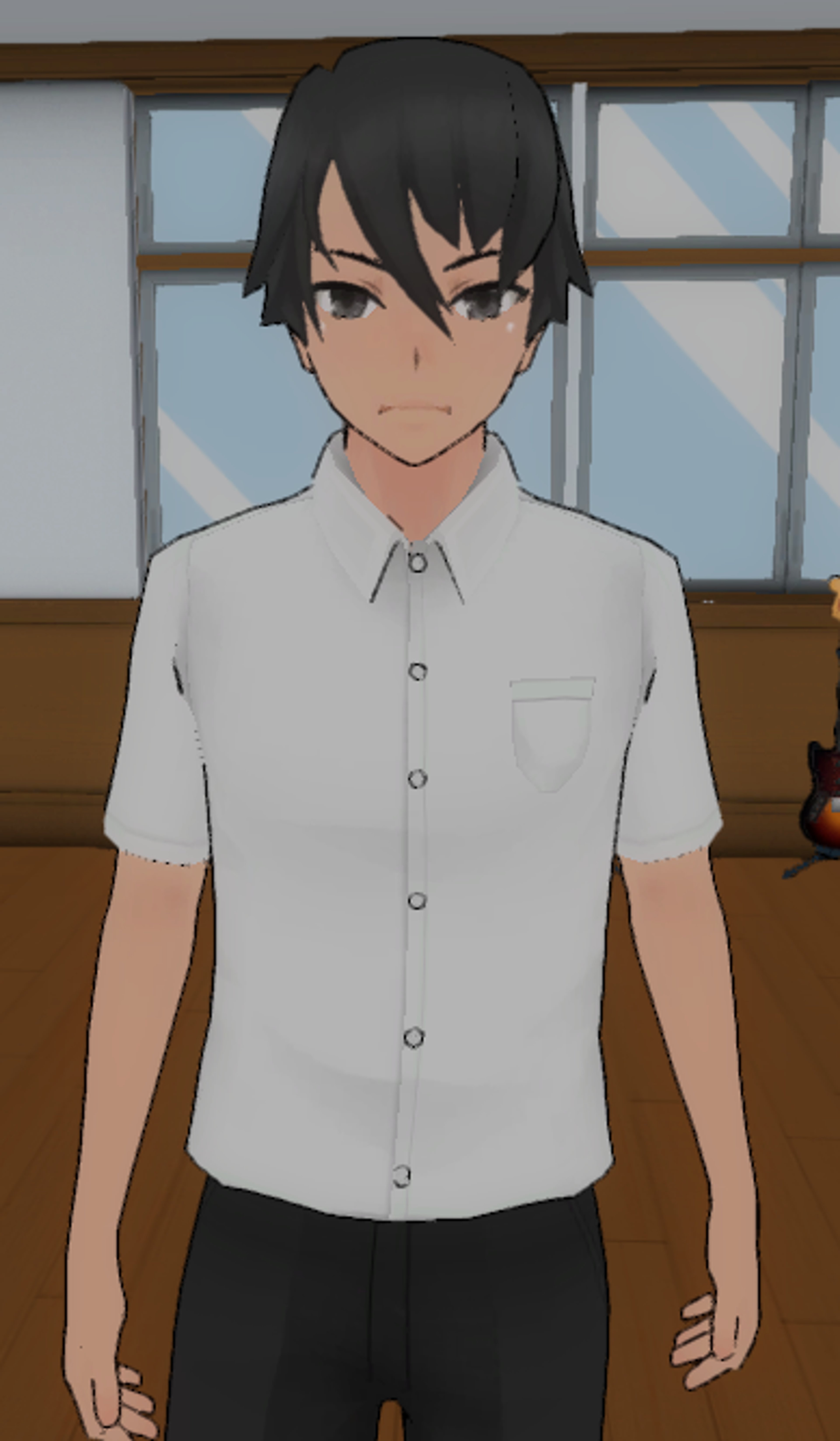 A young man with dark hair wearing a white shirt