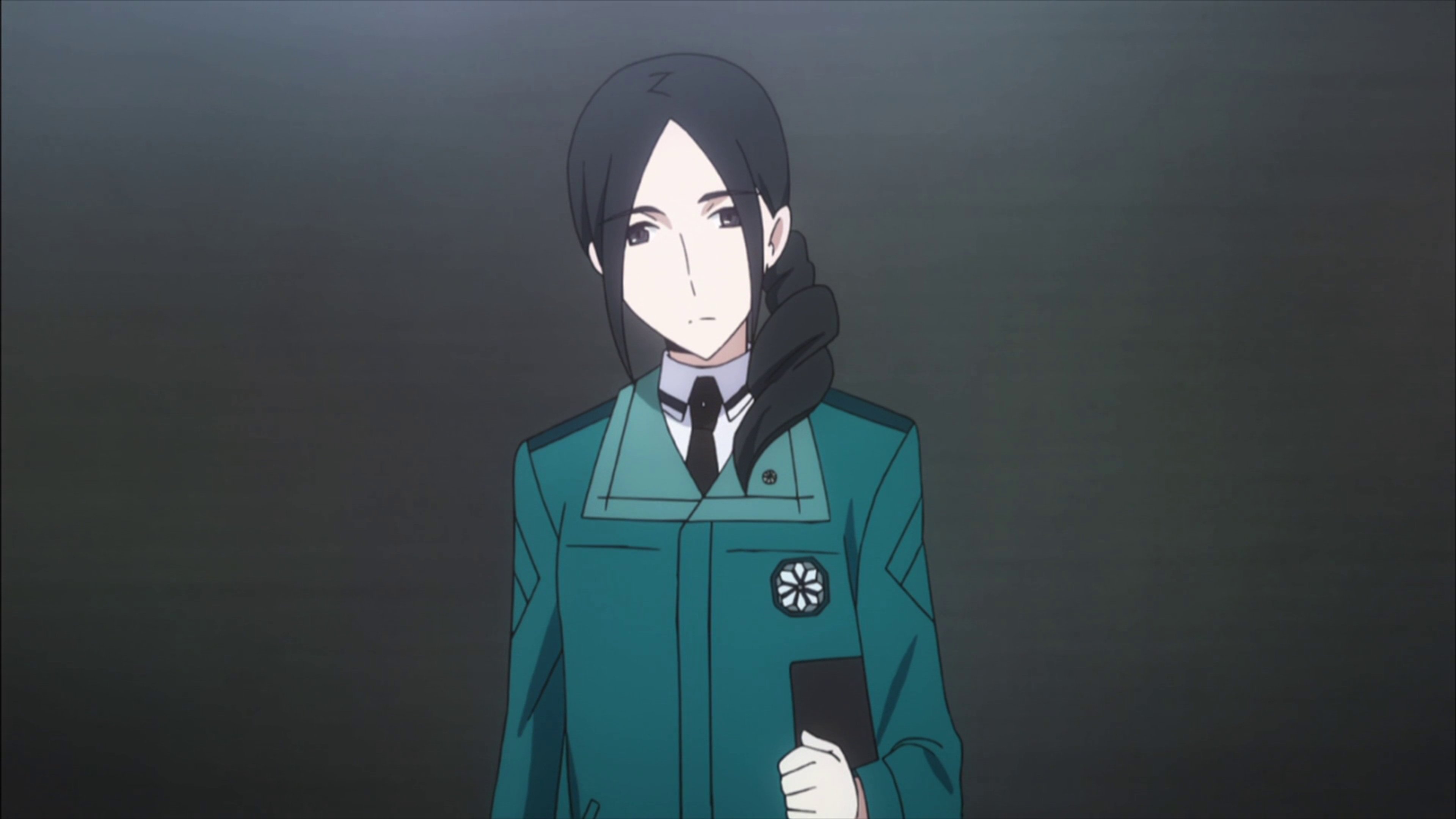 A young woman in a green school uniform with a serious expression