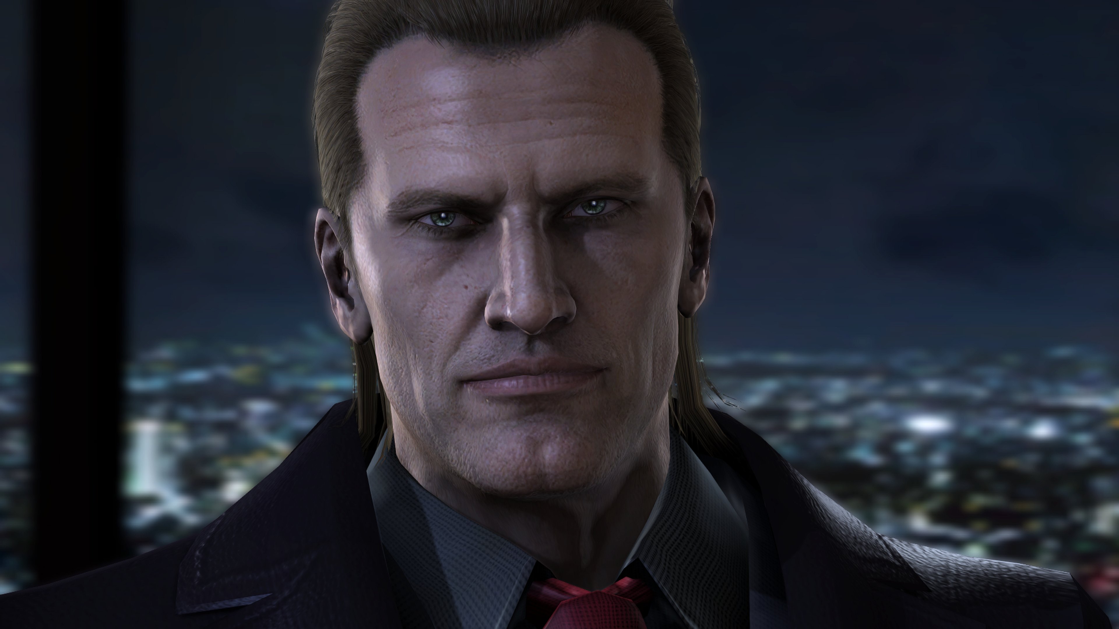 A serious-looking man in a suit overlooking a city skyline at night