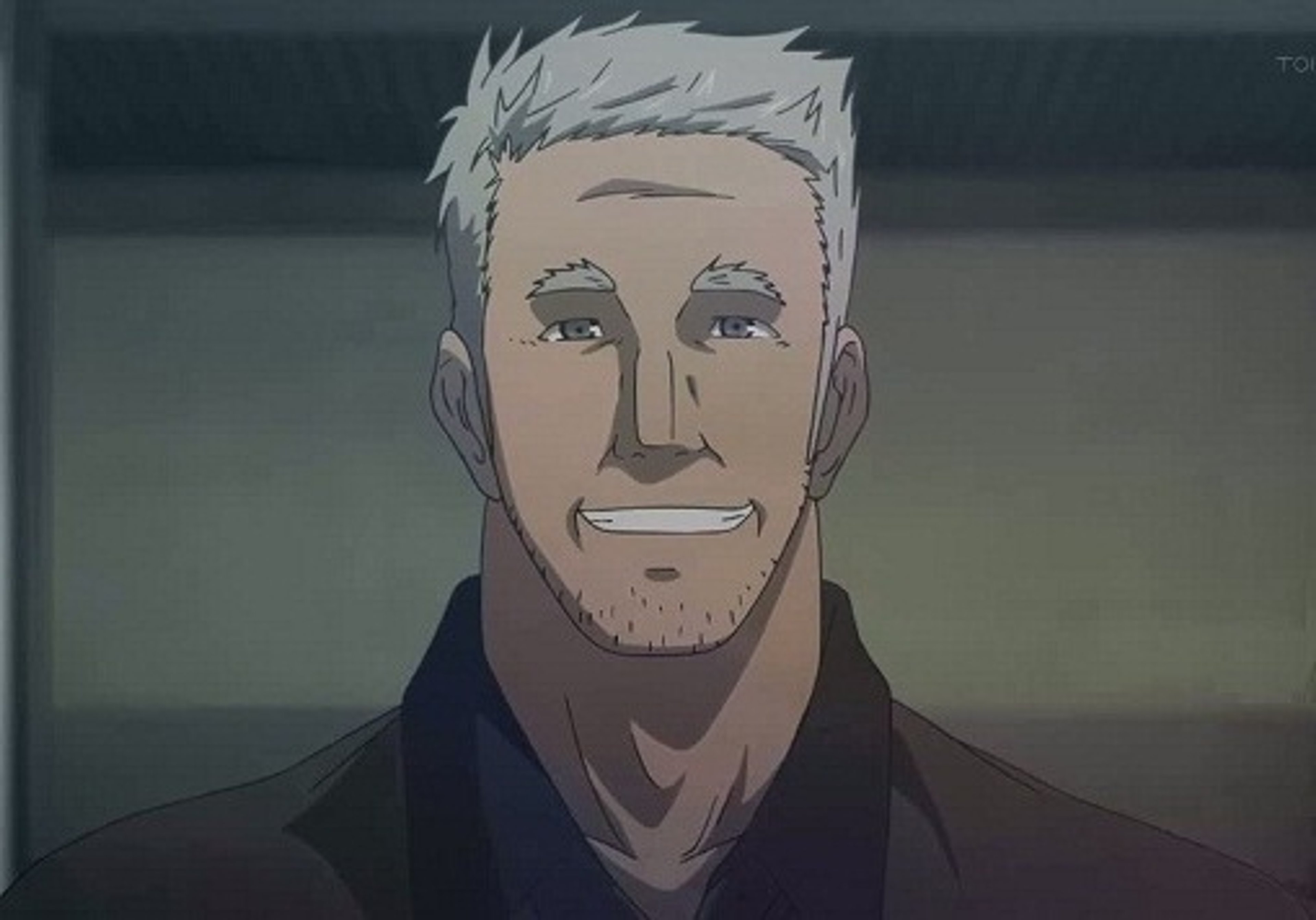 A middle-aged man with a stern expression and military-style attire