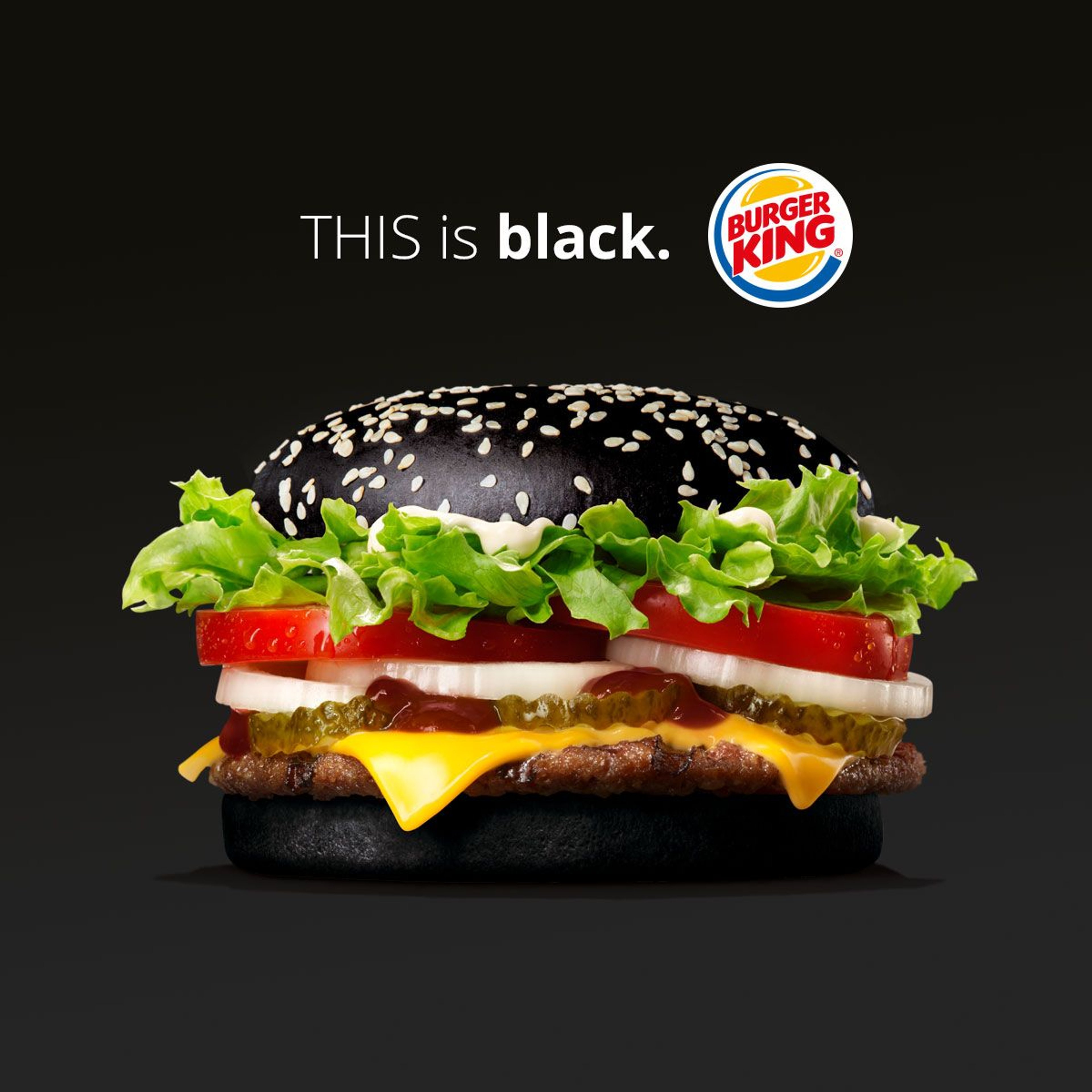 A Burger King Halloween Whopper burger with a black bun