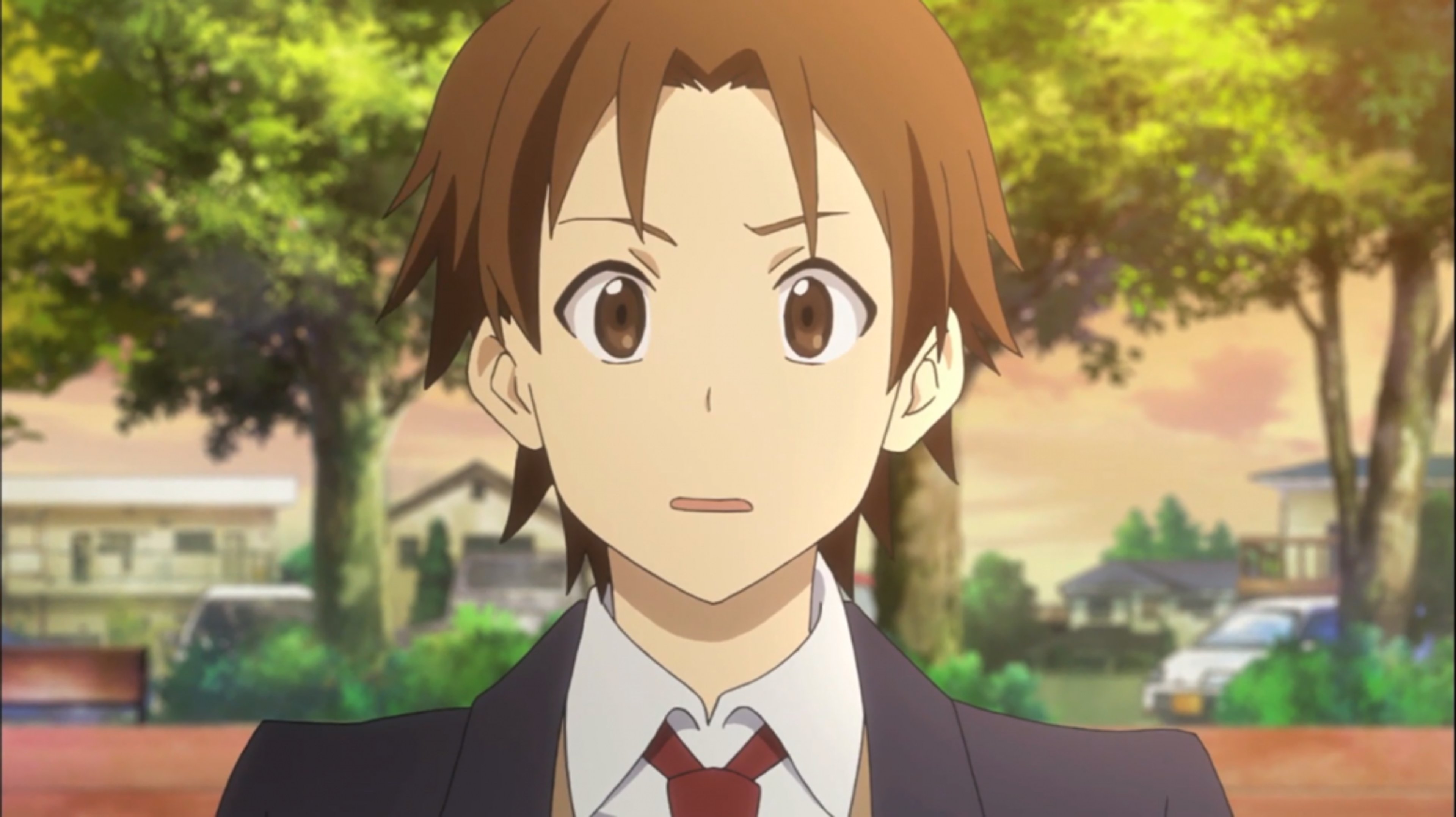 An anime character with short brown hair and a friendly expression, wearing a school uniform.