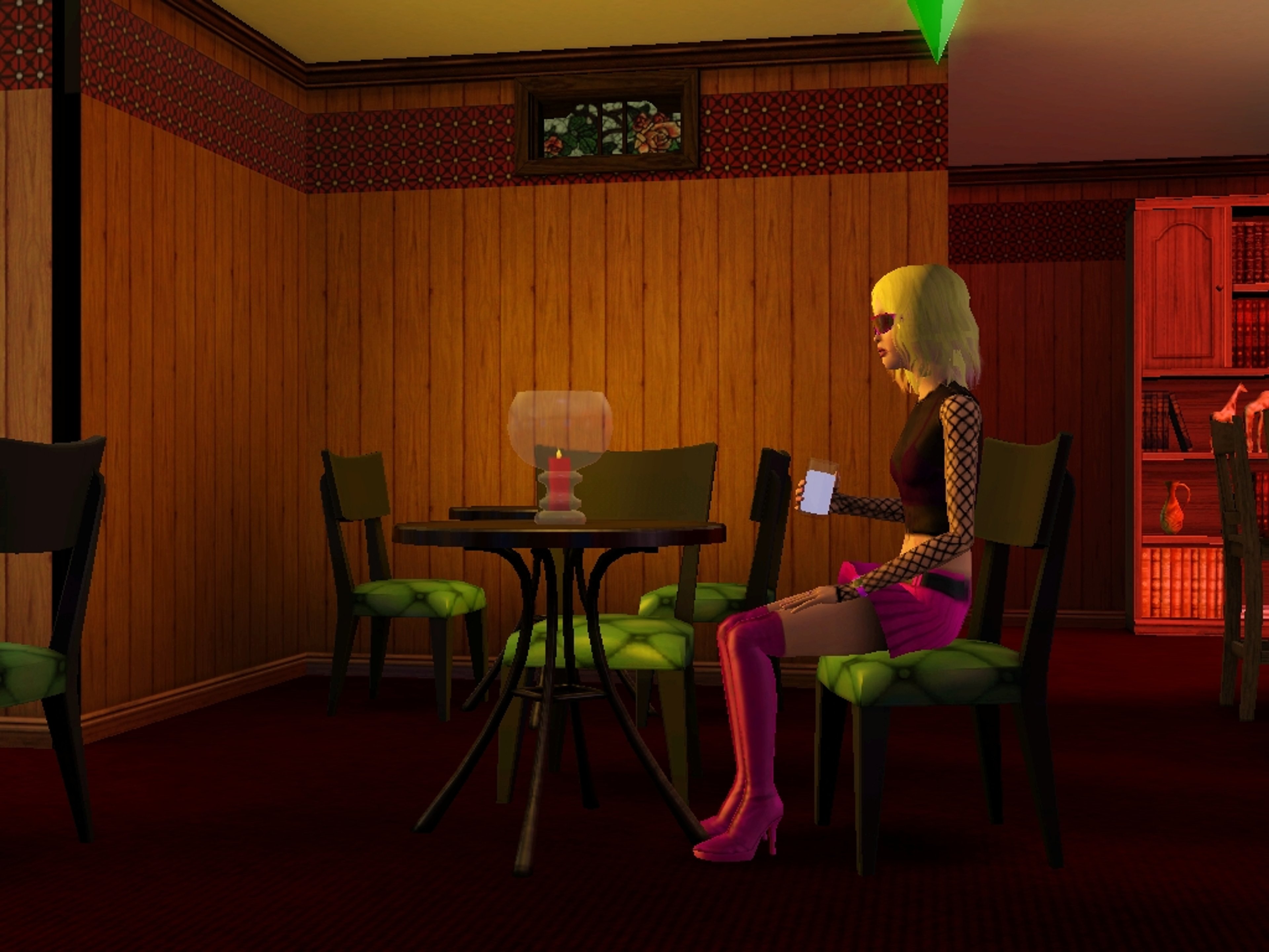 A young woman with blonde hair sitting at a table in a dimly lit room.