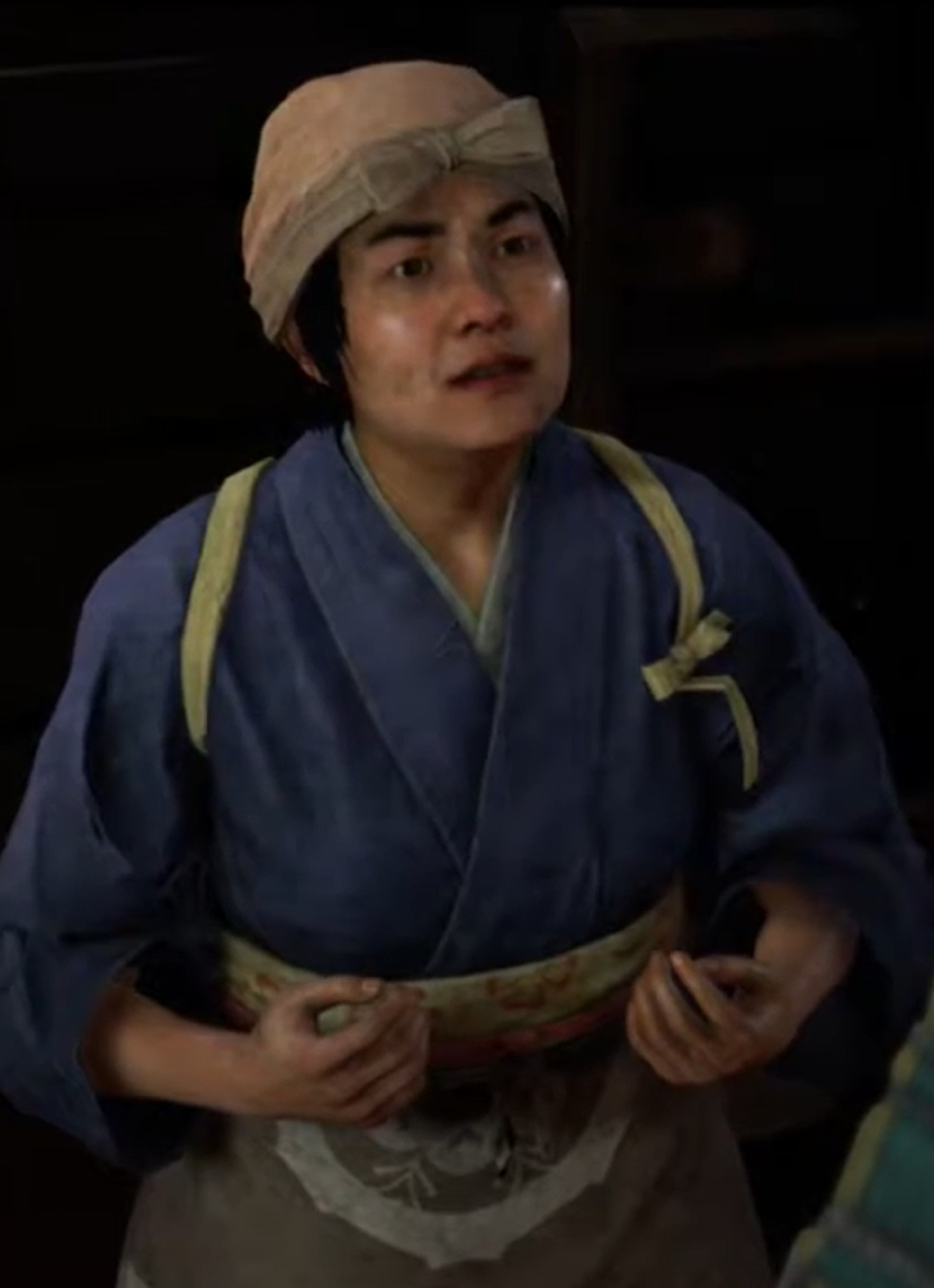 A woman in traditional Japanese clothing with a thoughtful expression