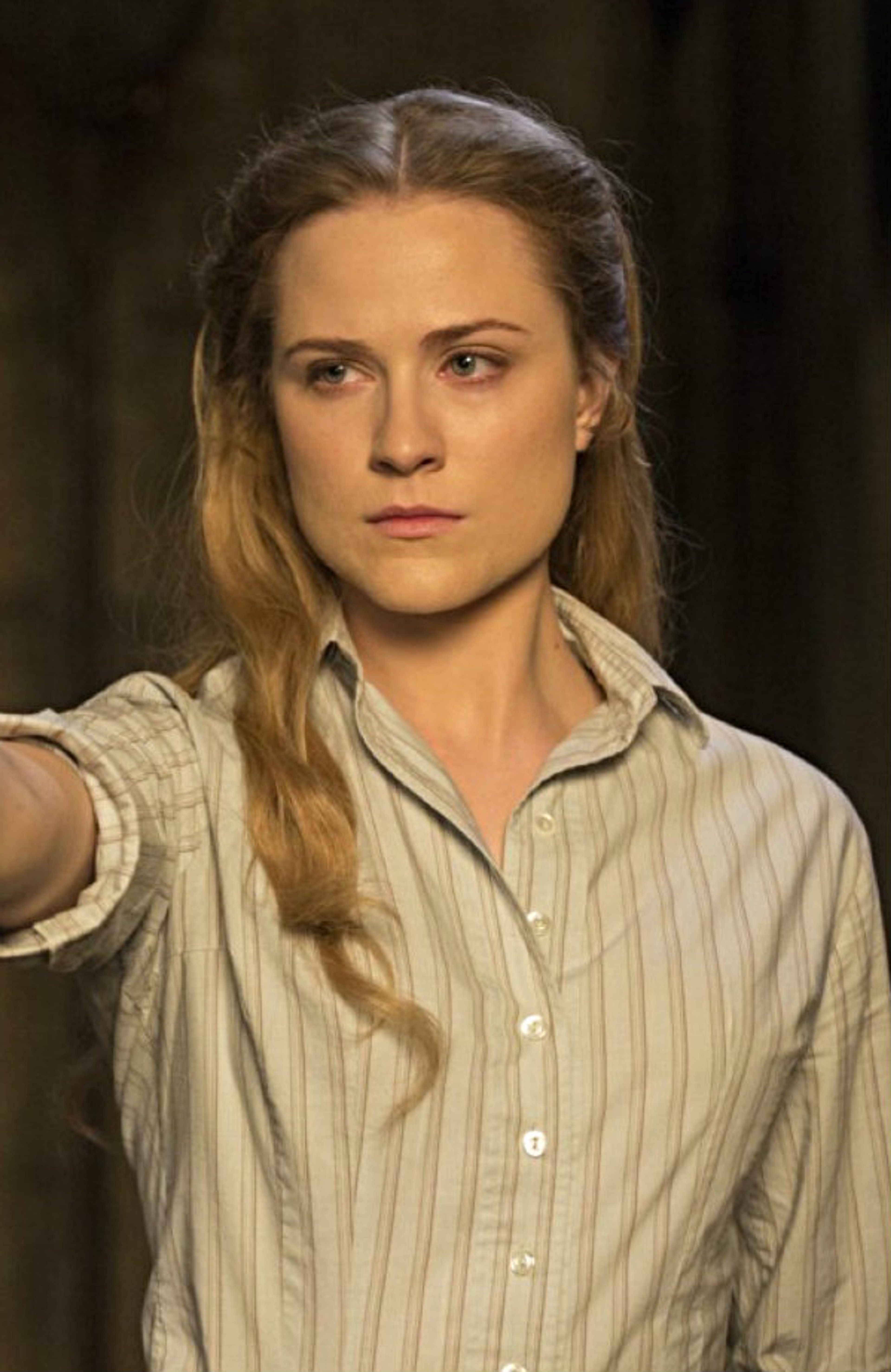 A young woman with long blonde hair wearing a striped shirt