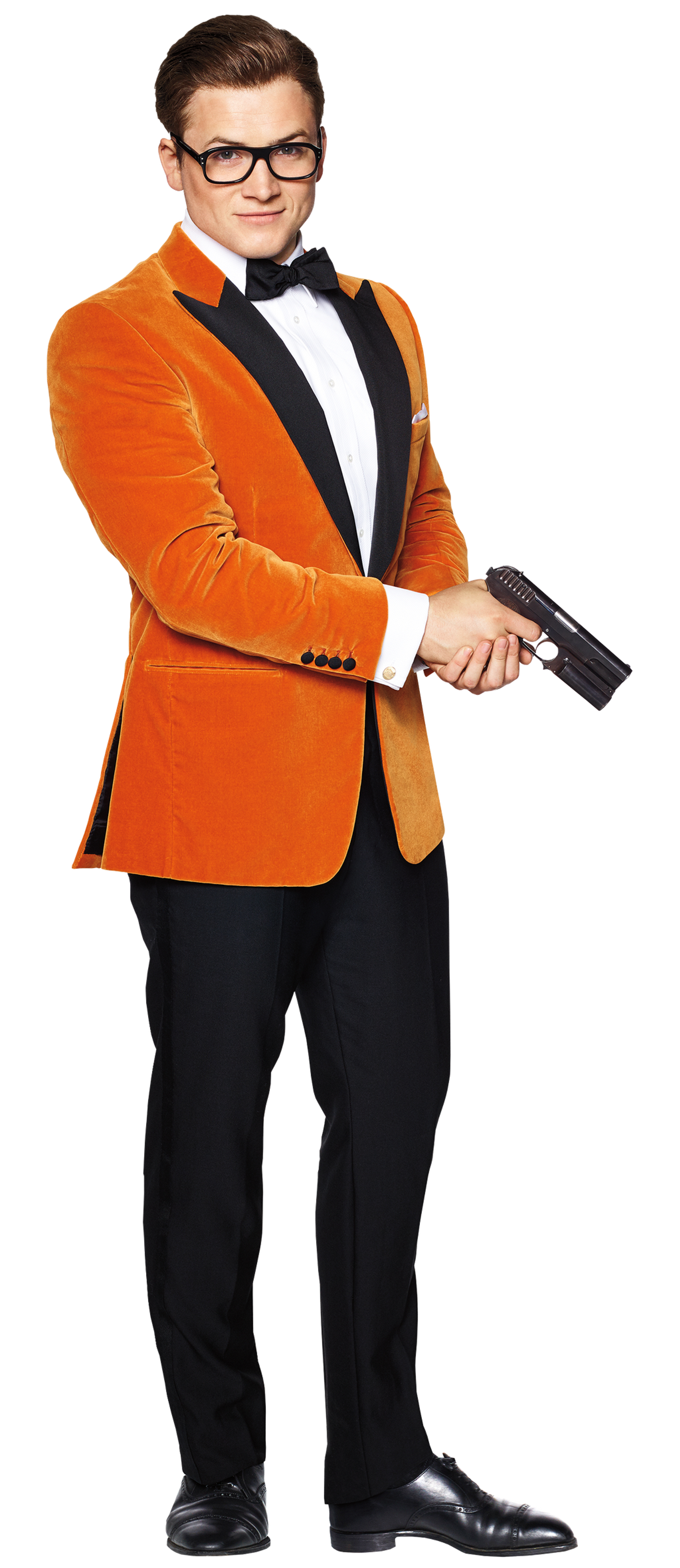 A well-dressed young man in an orange velvet suit jacket holding a handgun
