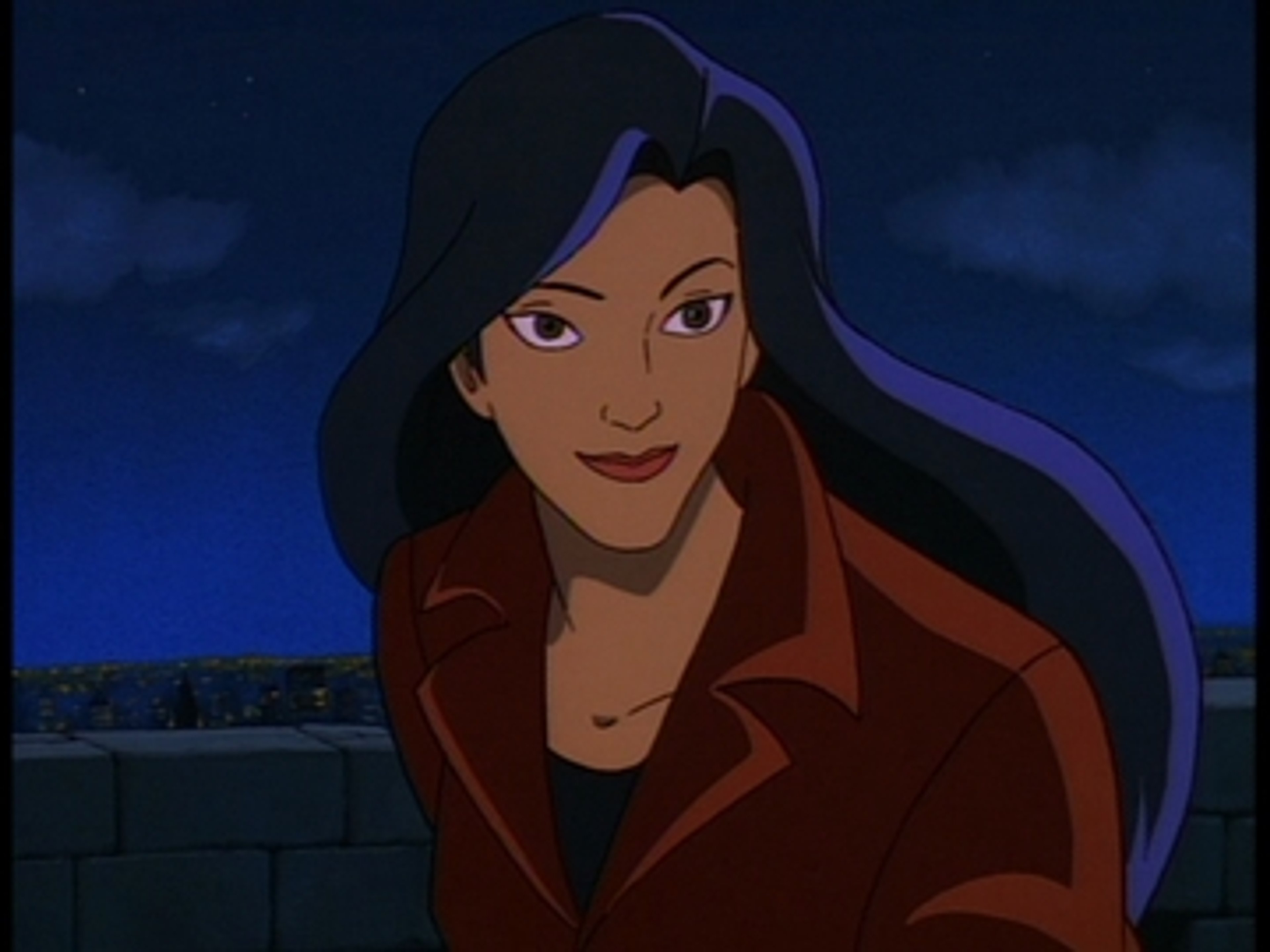 A young woman with dark hair wearing a red jacket