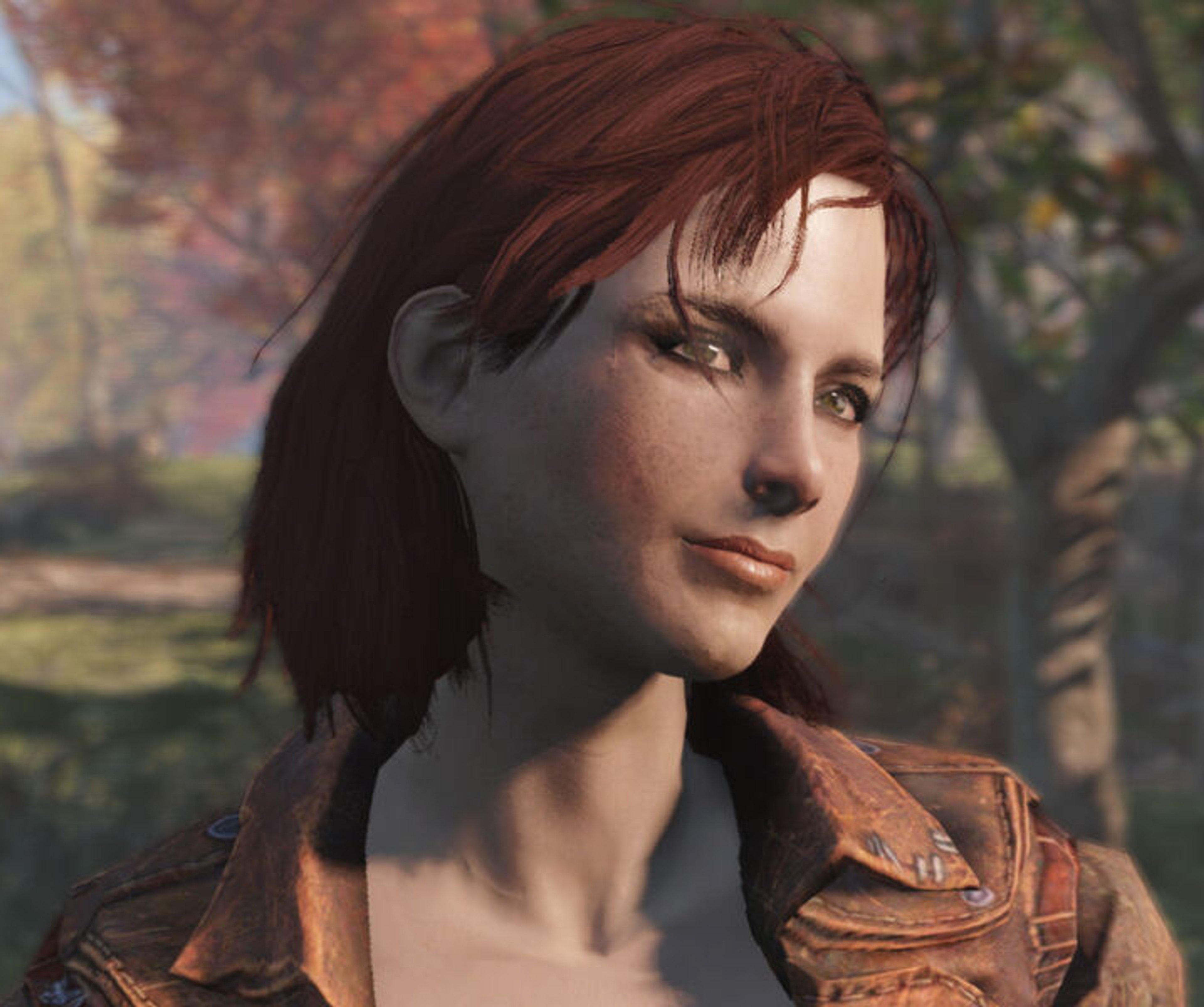 A young woman with dark brown hair wearing a brown leather jacket in an outdoor setting