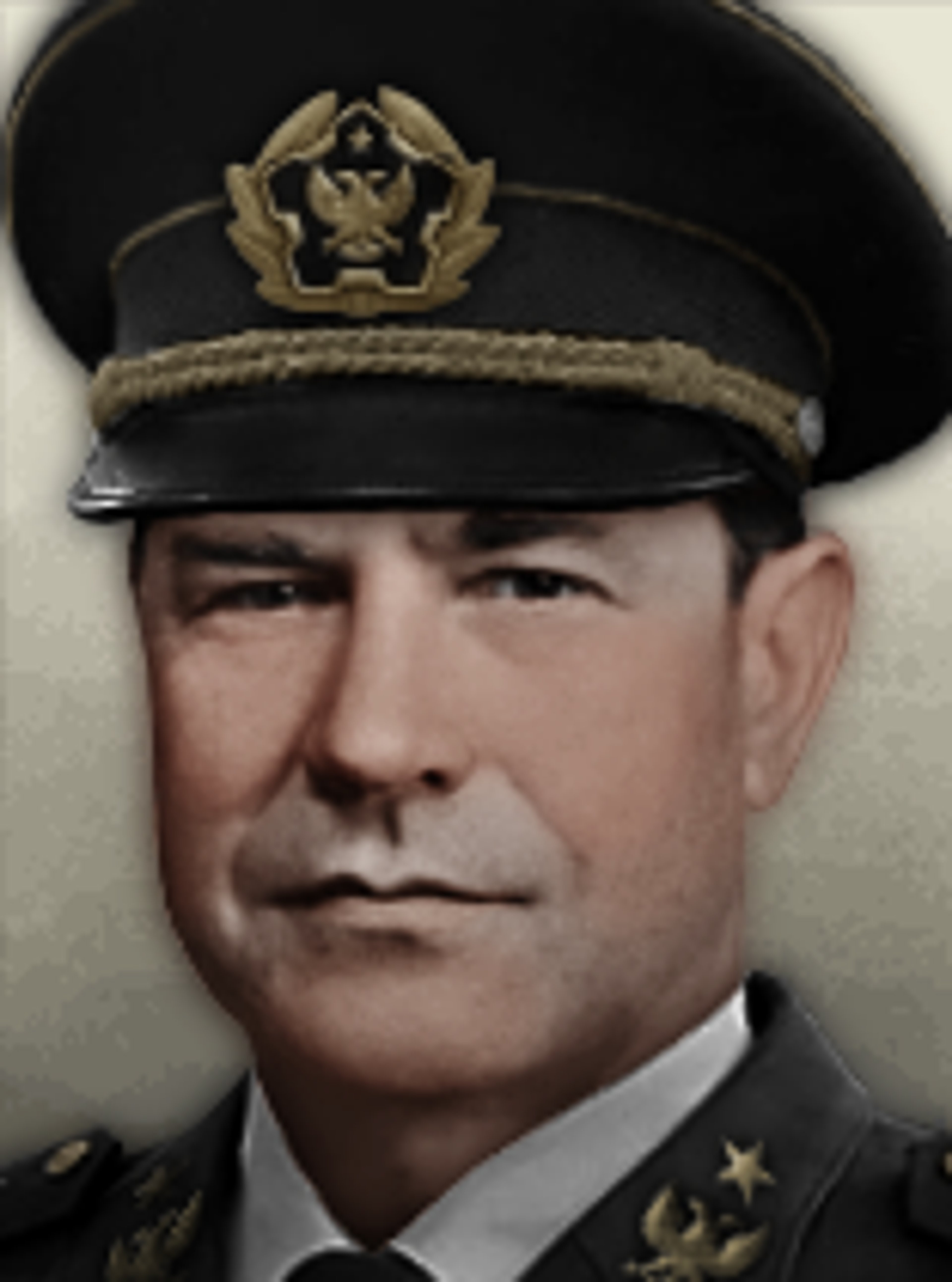 A middle-aged man in a military uniform with a peaked cap