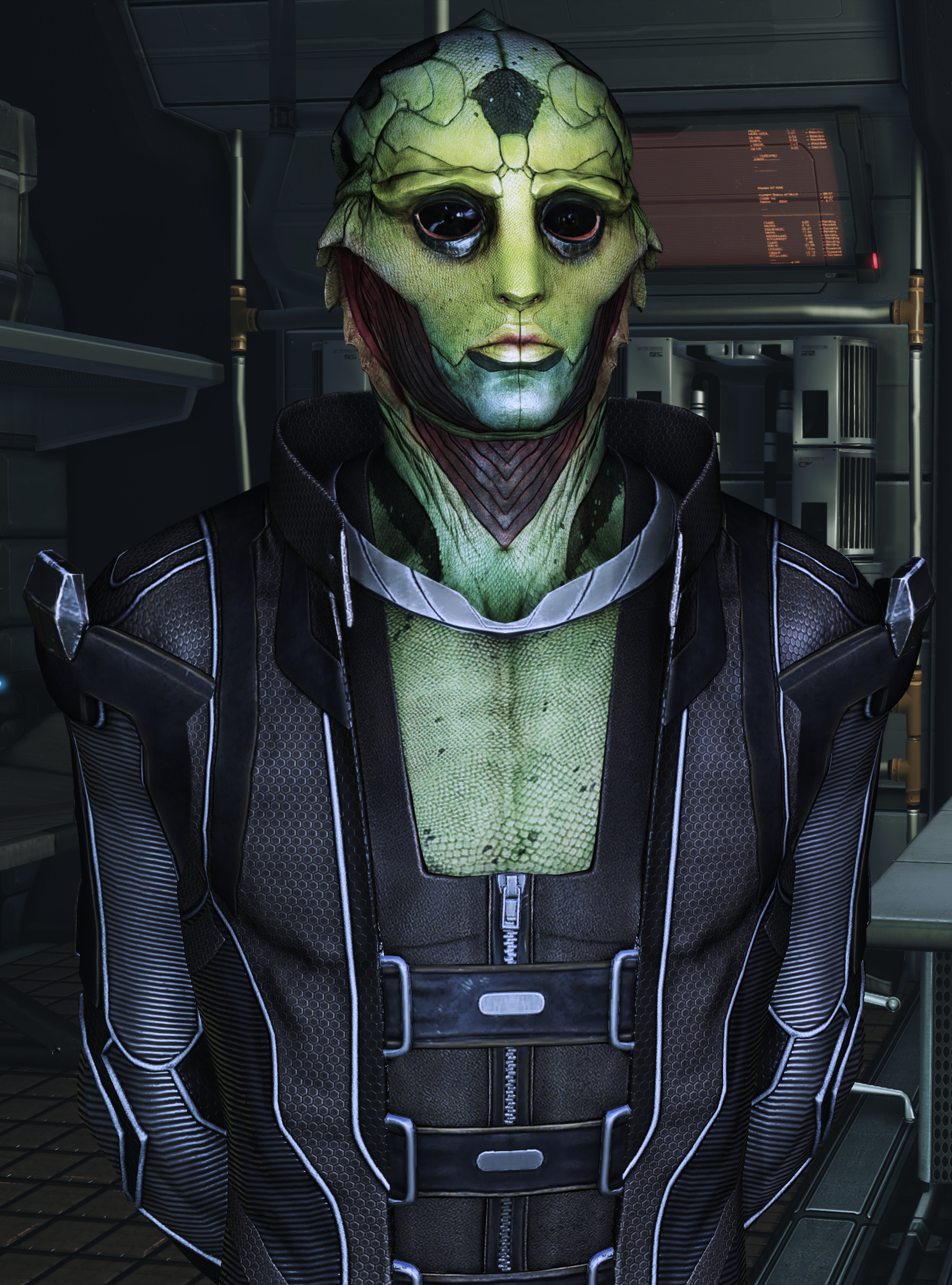 A close-up portrait of a green-skinned alien character in a dark, armored bodysuit