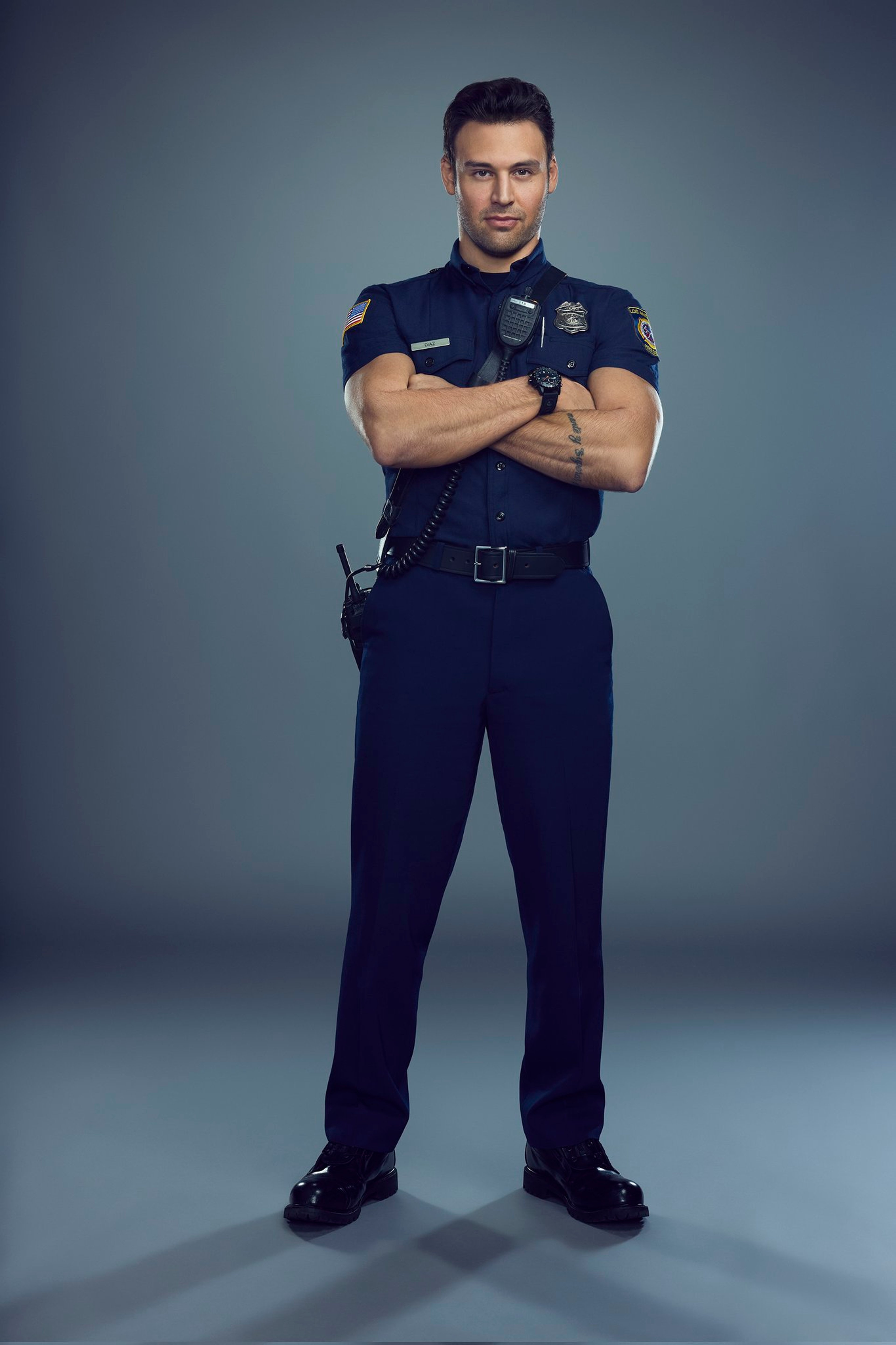 A firefighter in uniform with a serious expression