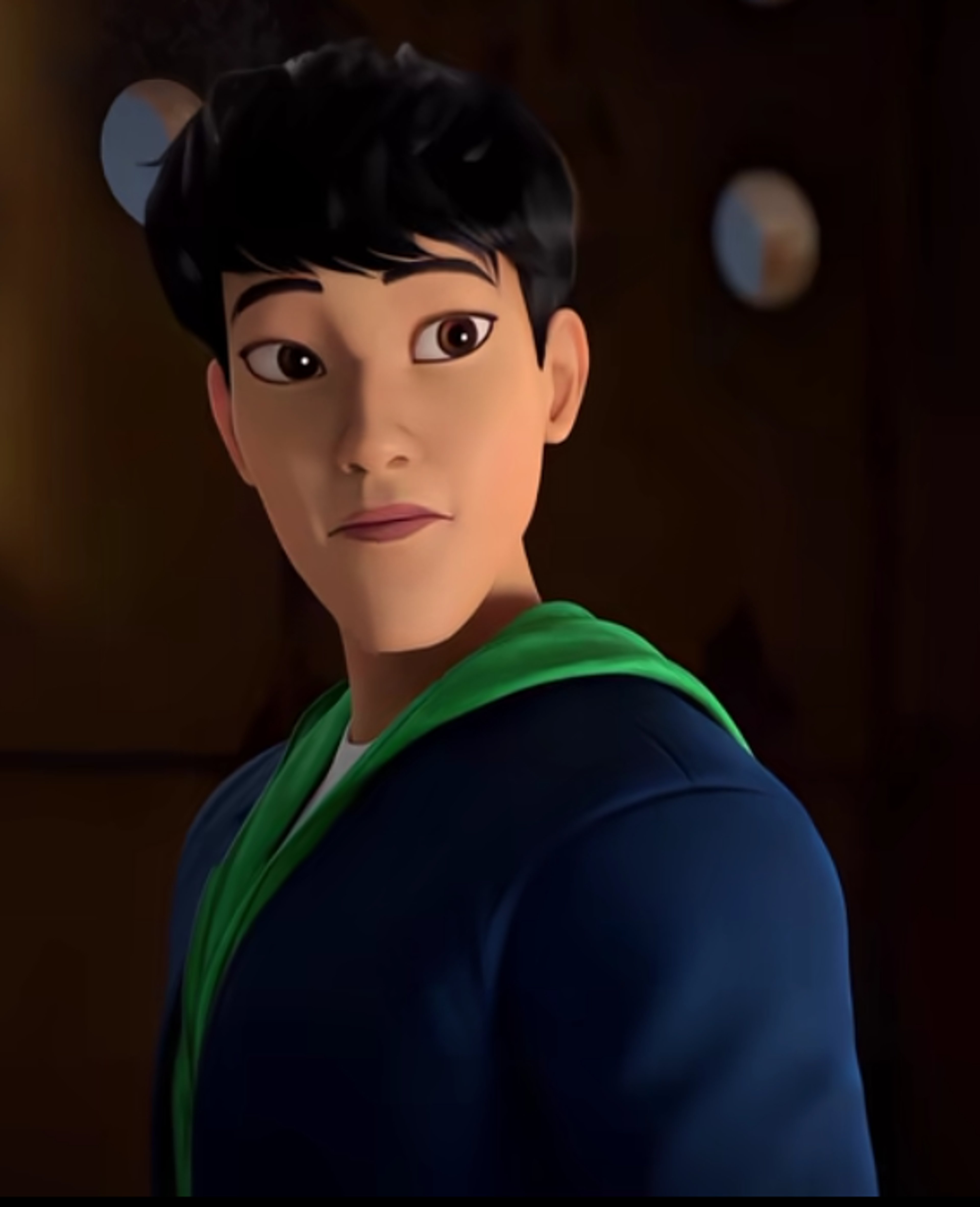 An animated character with short dark hair wearing a navy blue jacket and green shirt