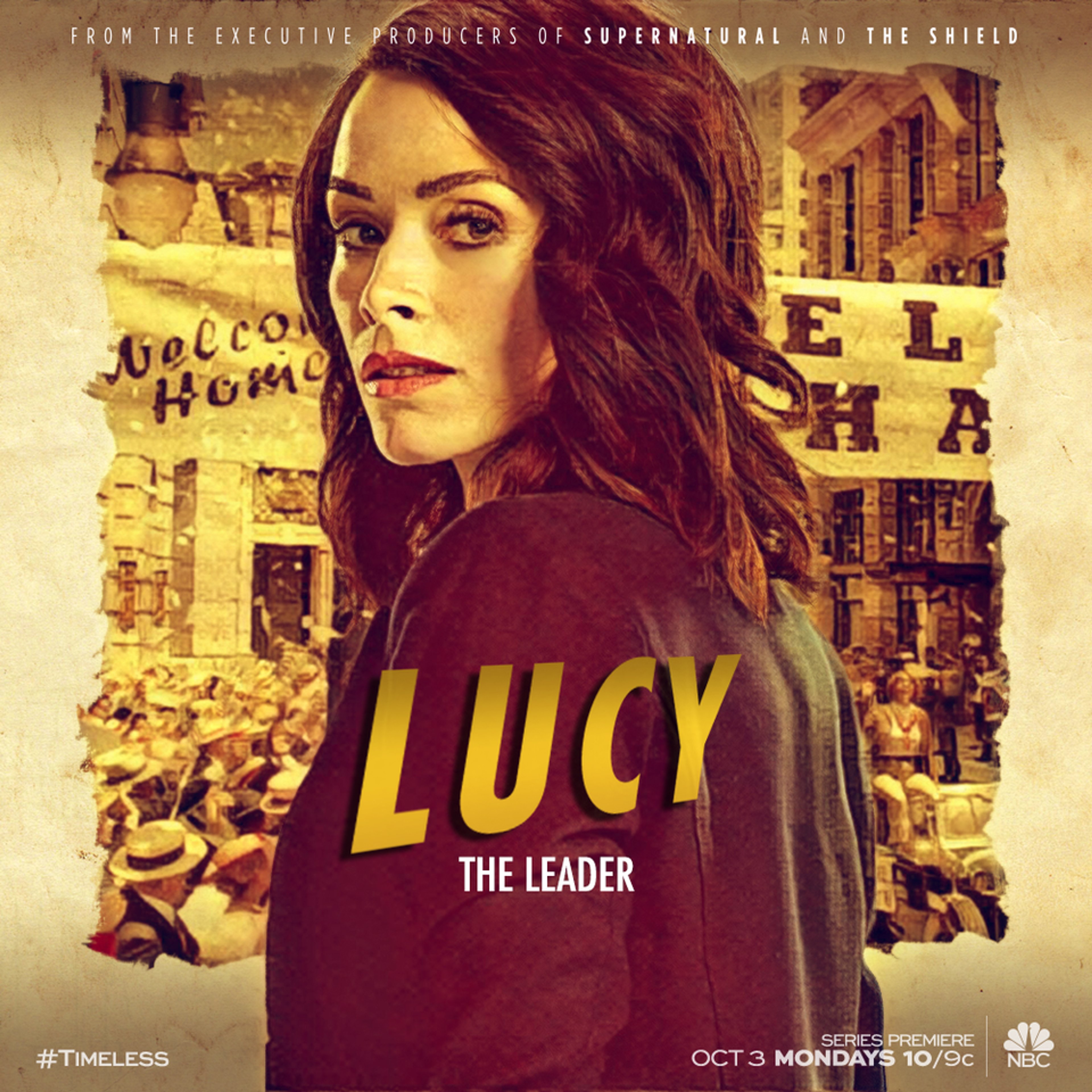 A woman with dark hair wearing a red shirt that says 'LUCY' on it, standing in front of a city street background.
