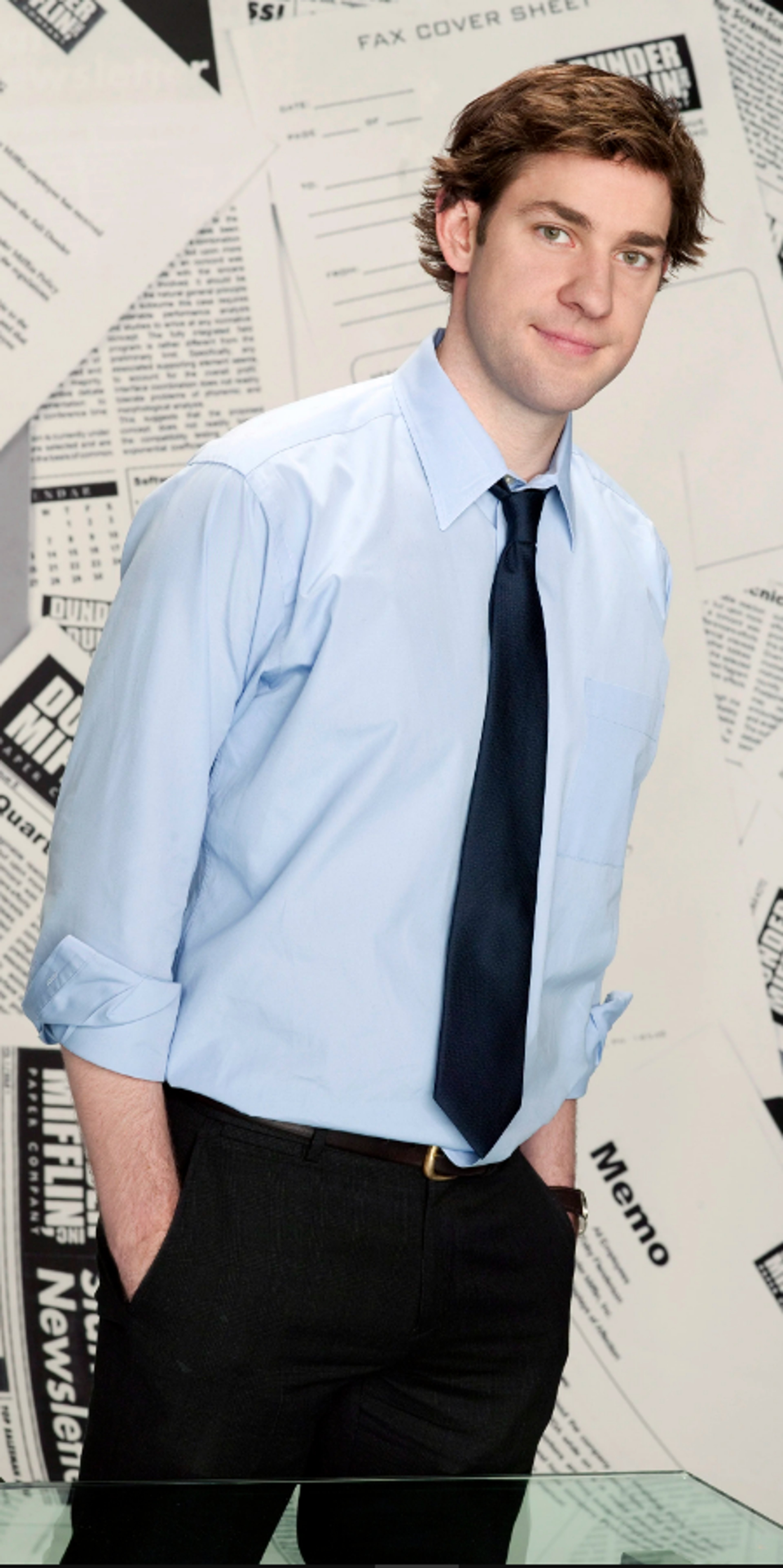 A young man in a dress shirt and tie in an office setting