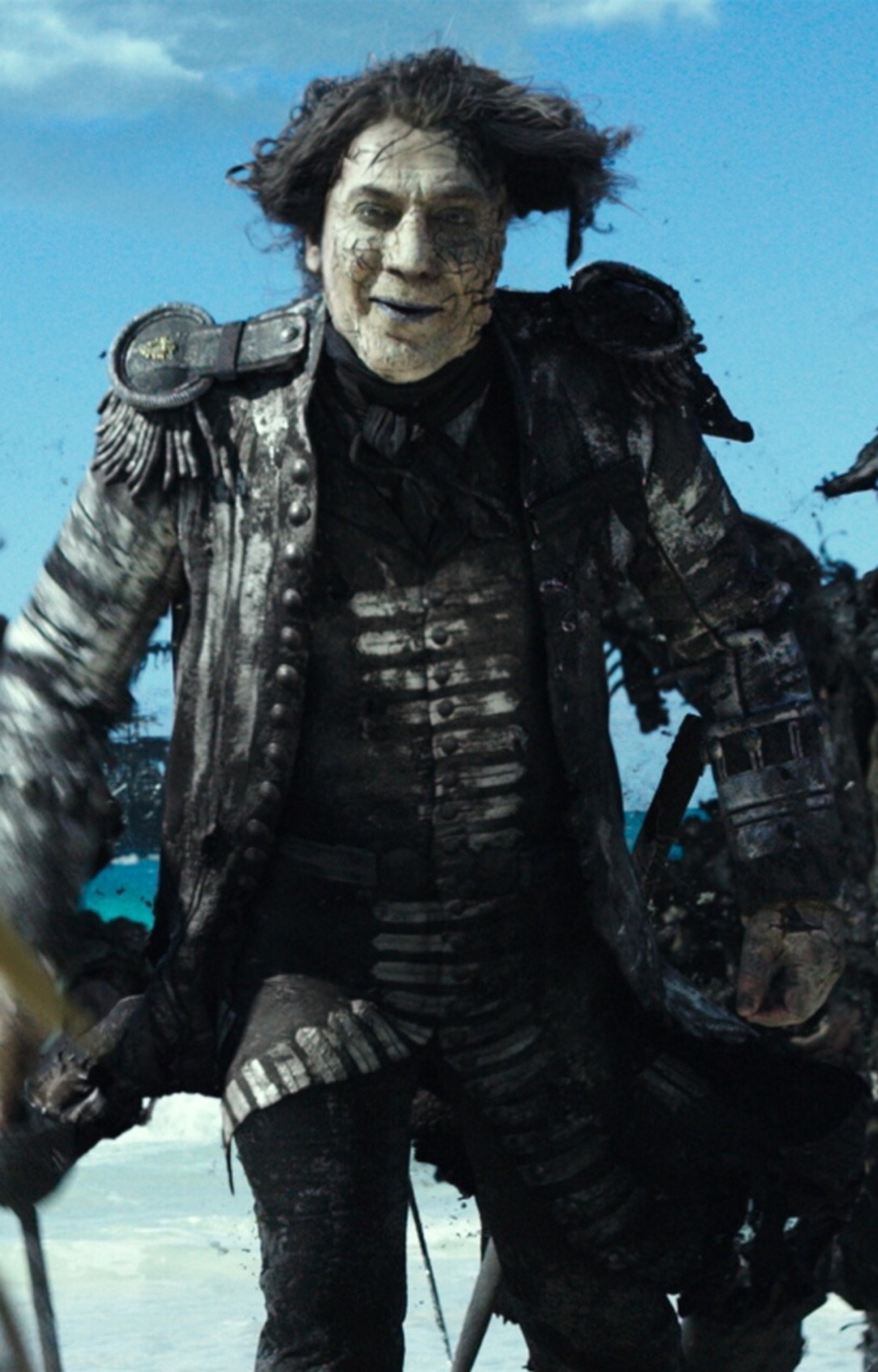 A man in a dark military uniform with a stern expression