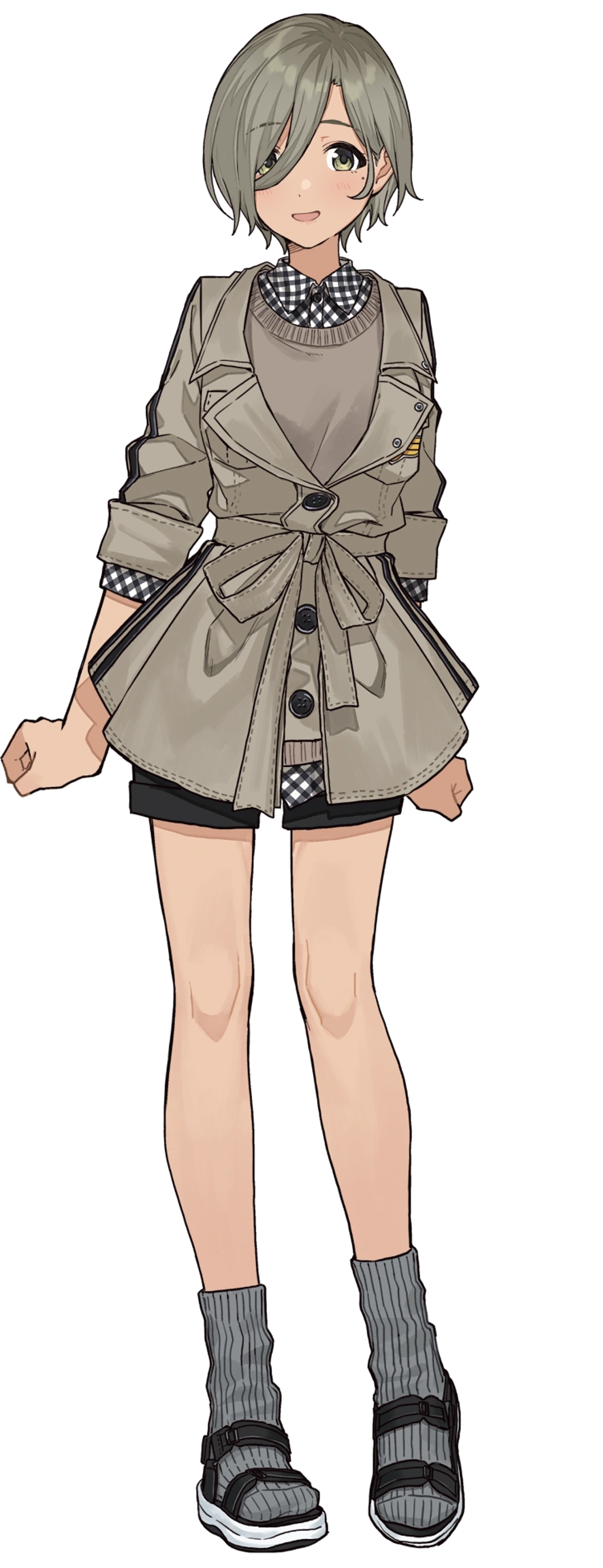 A young woman with short gray-olive hair wearing a beige jacket and black and white checkered shirt.