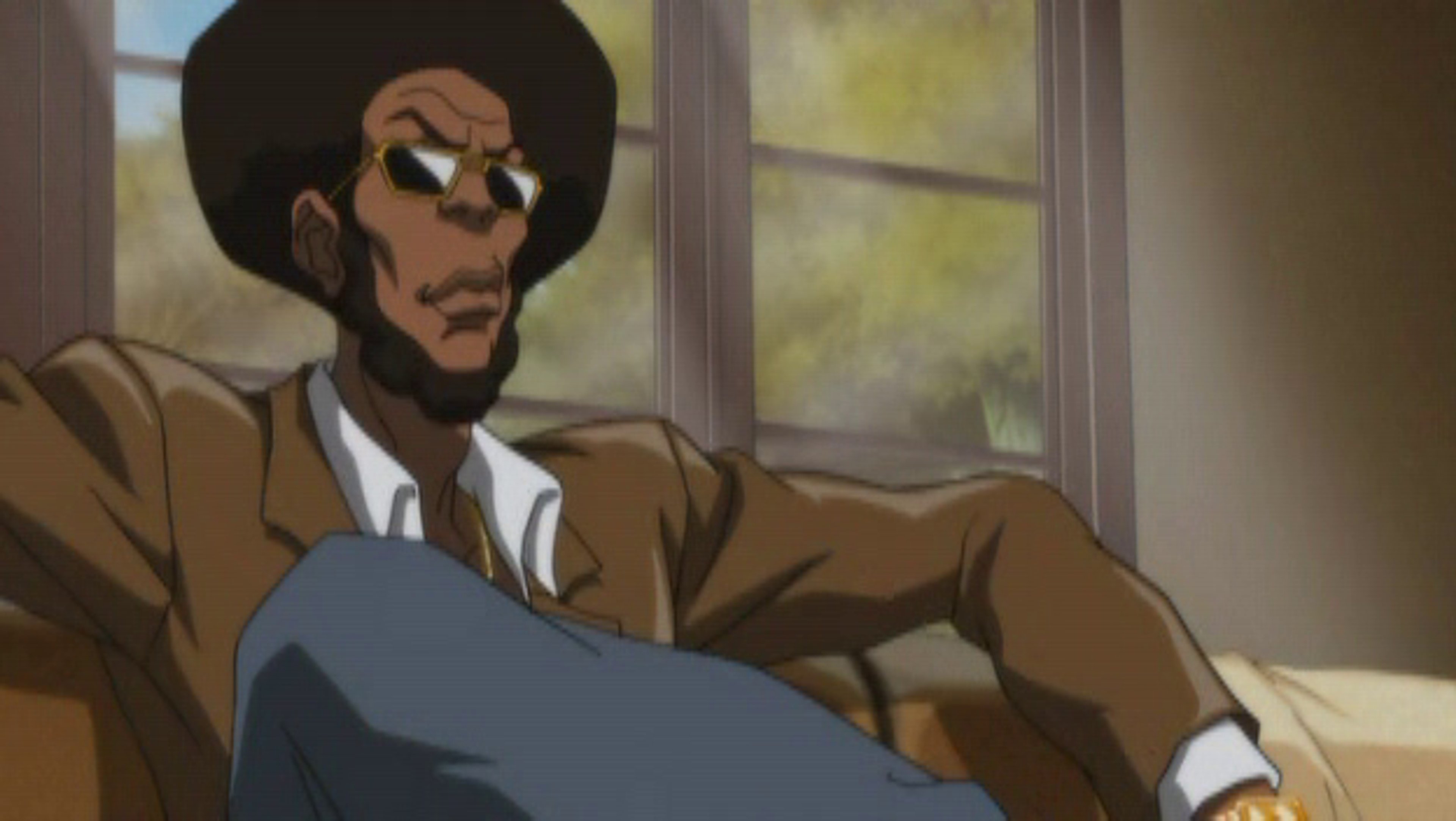A serious-looking Black man in a tan trenchcoat and hat, with a muscular build and stern expression.