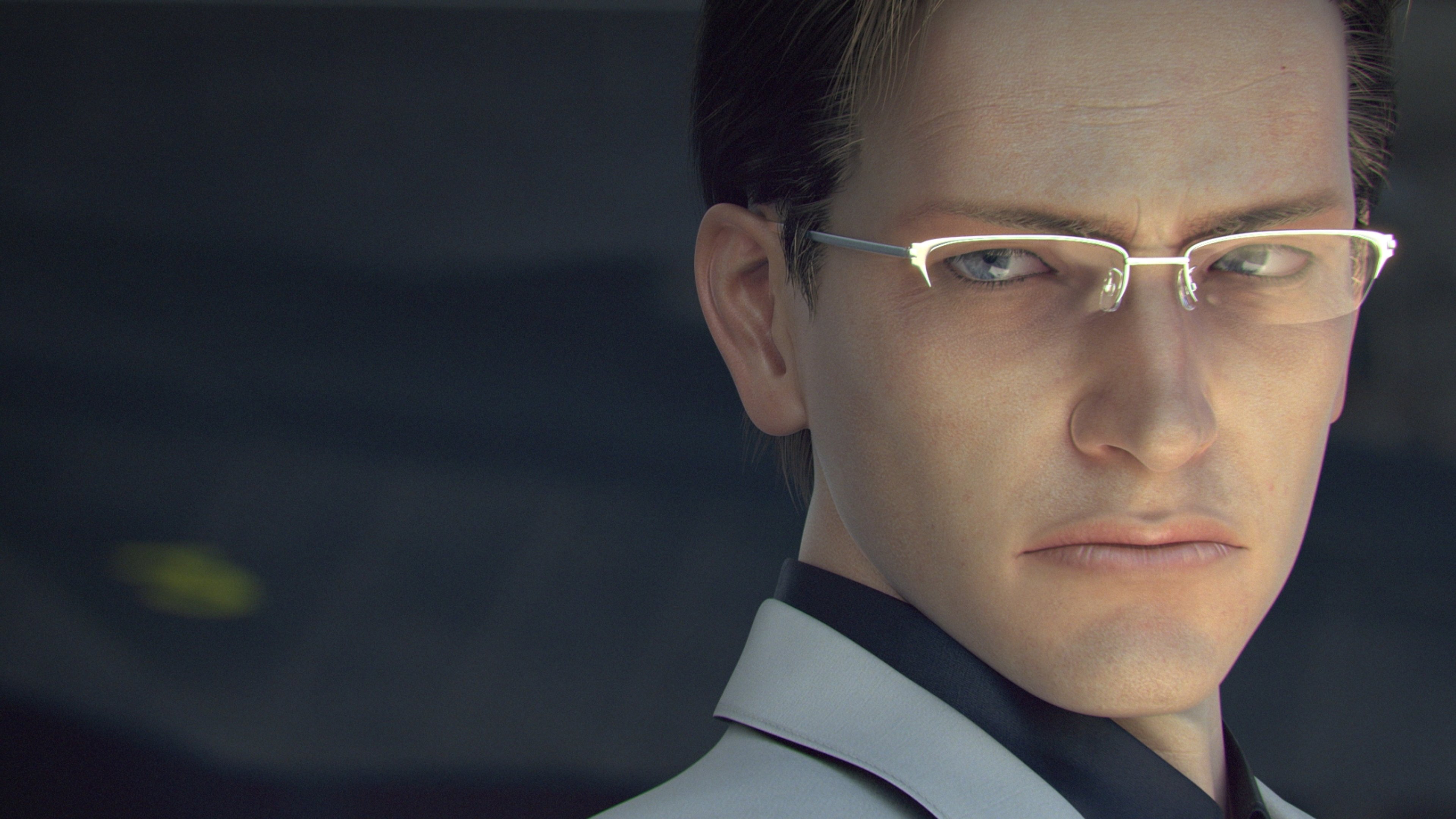 A middle-aged Caucasian man with short brown hair and blue eyes, wearing a white collared shirt and having a stern, focused expression.