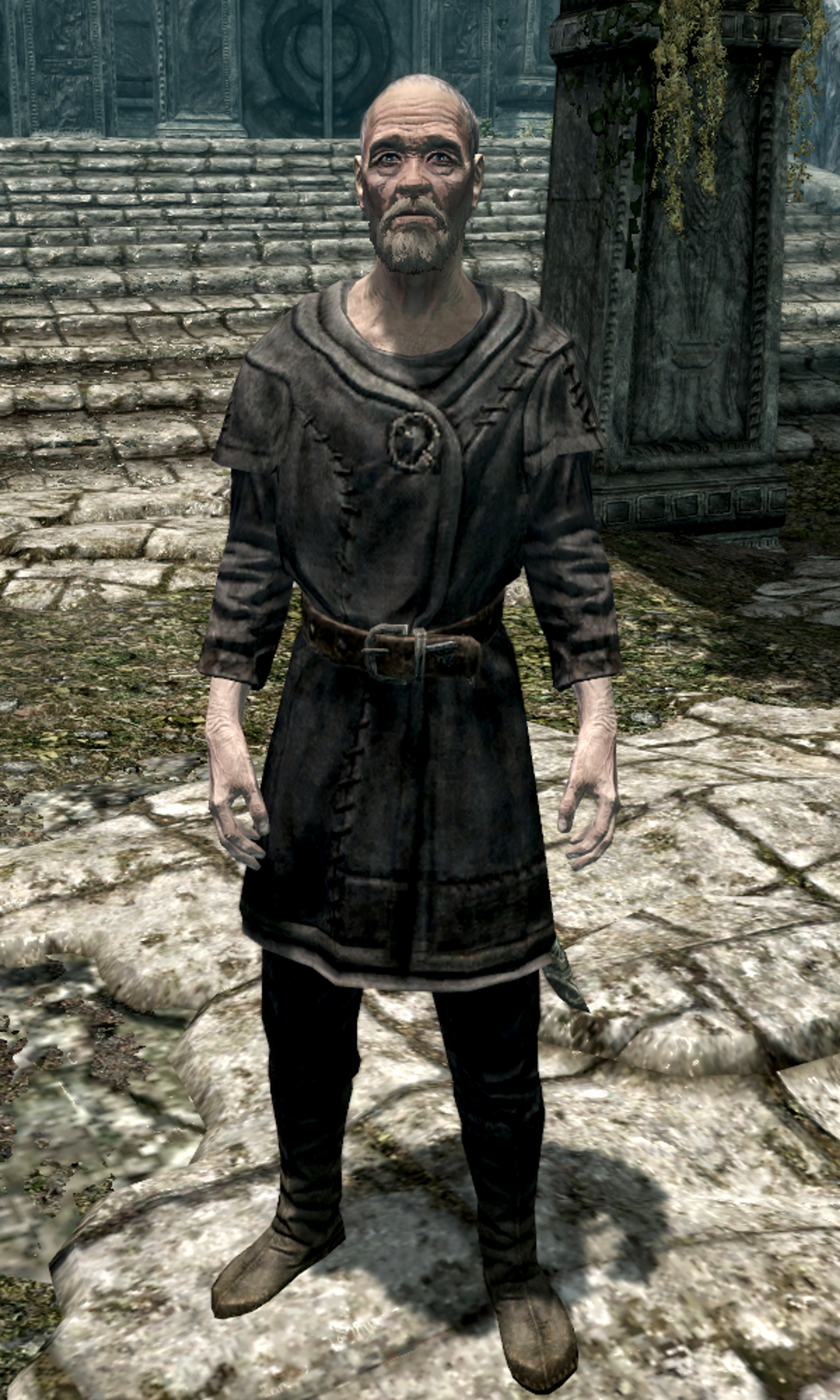 An elderly Nord man with white hair and beard, wearing practical clothing and looking serious.