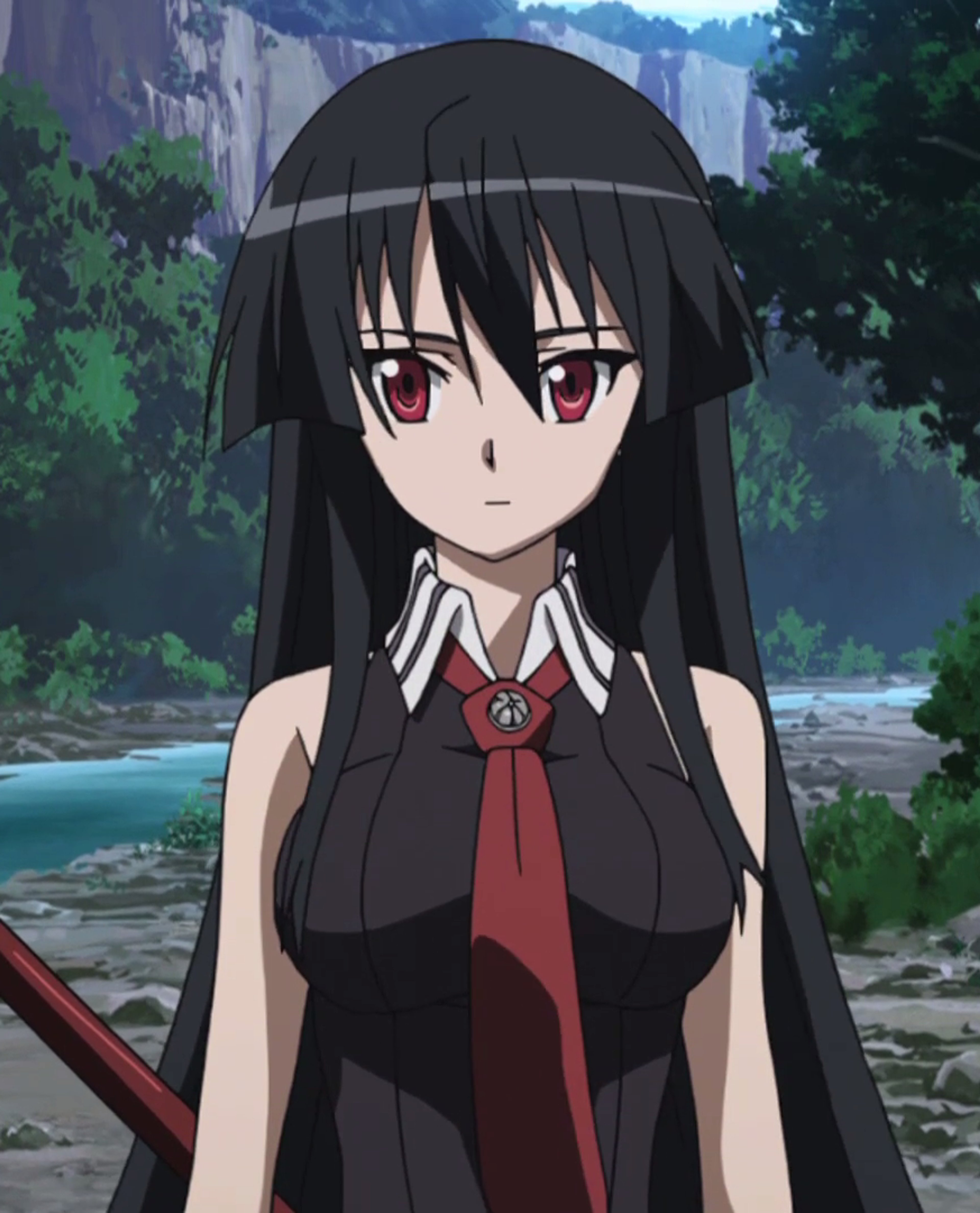 A young woman with dark hair and red eyes wearing a black outfit with a red sash