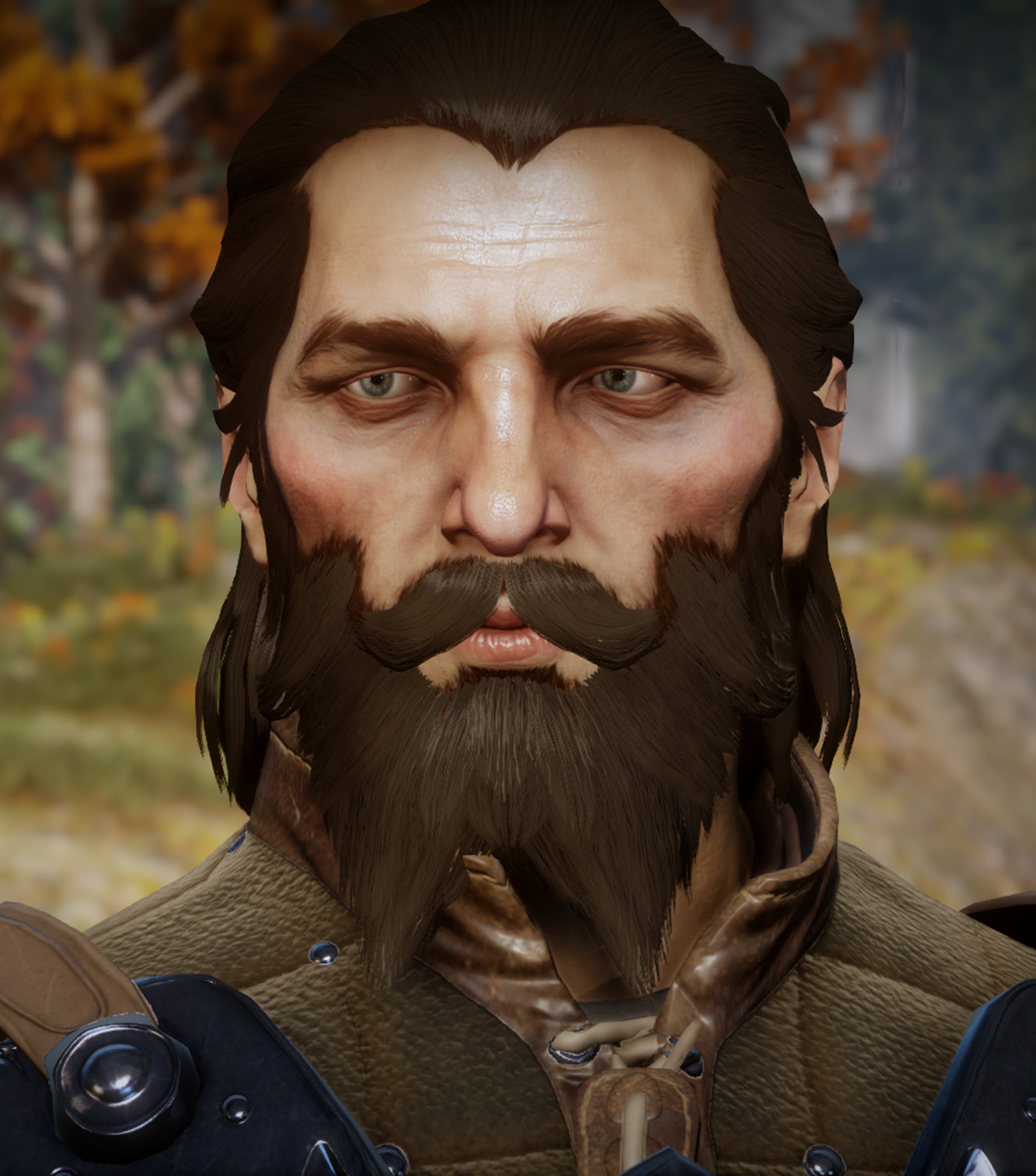 A man with a thick beard and long dark hair wearing a dark blue coat or jacket