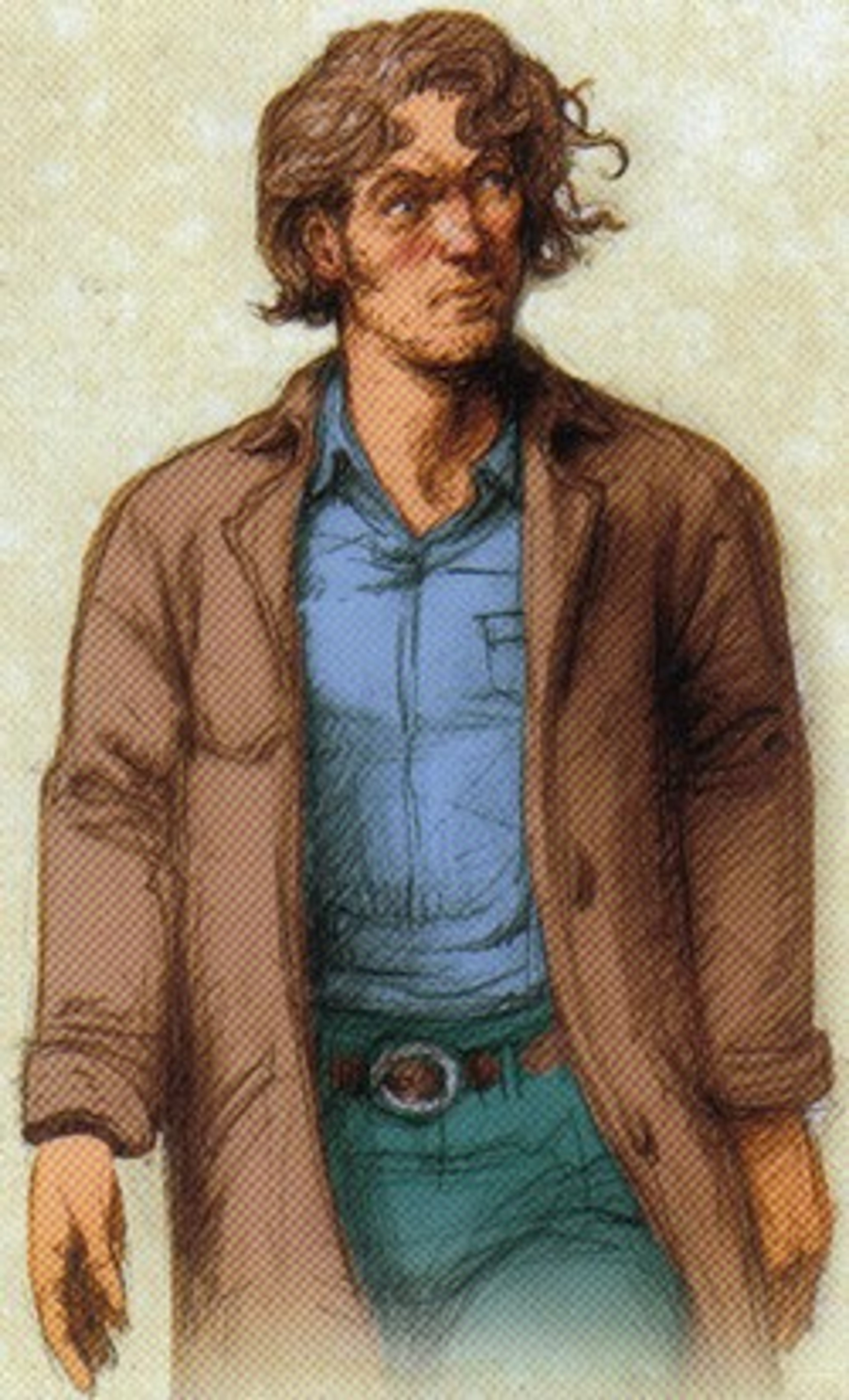 A middle-aged man with brown curly hair and a friendly expression