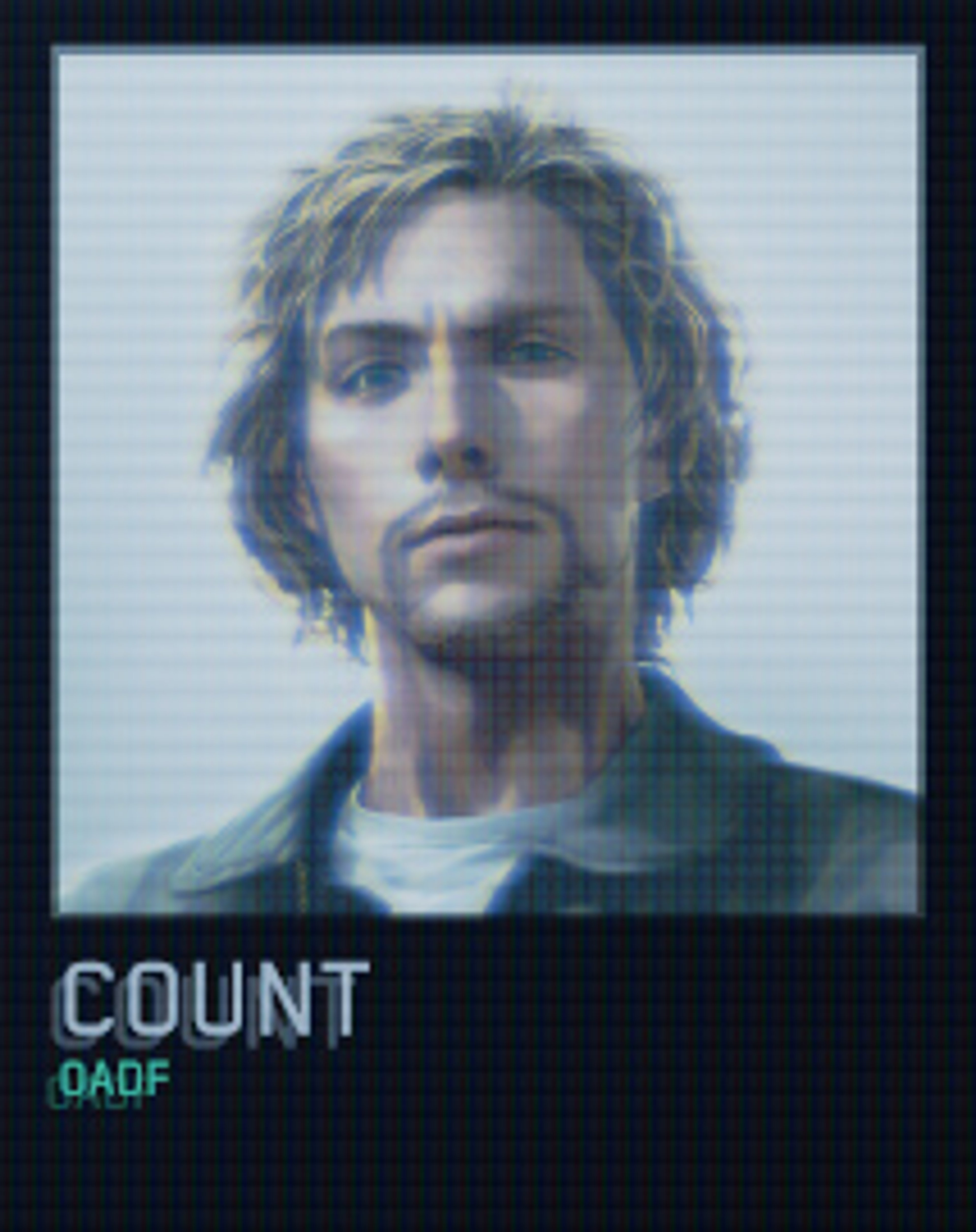 A close-up portrait of a man with blonde hair and a serious expression