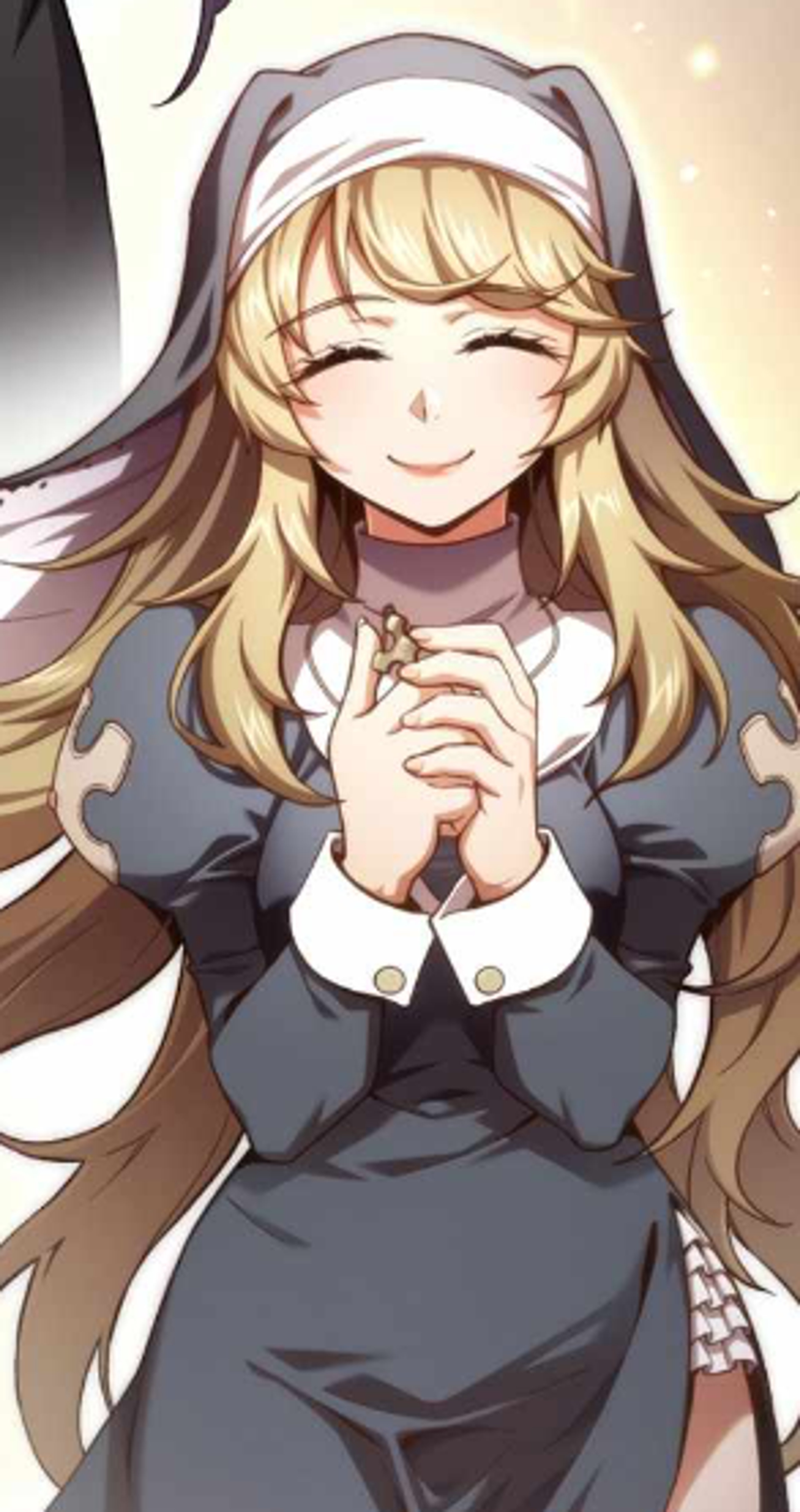 A young woman in a black dress with a cheerful expression, her hands clasped together in a prayer-like gesture.