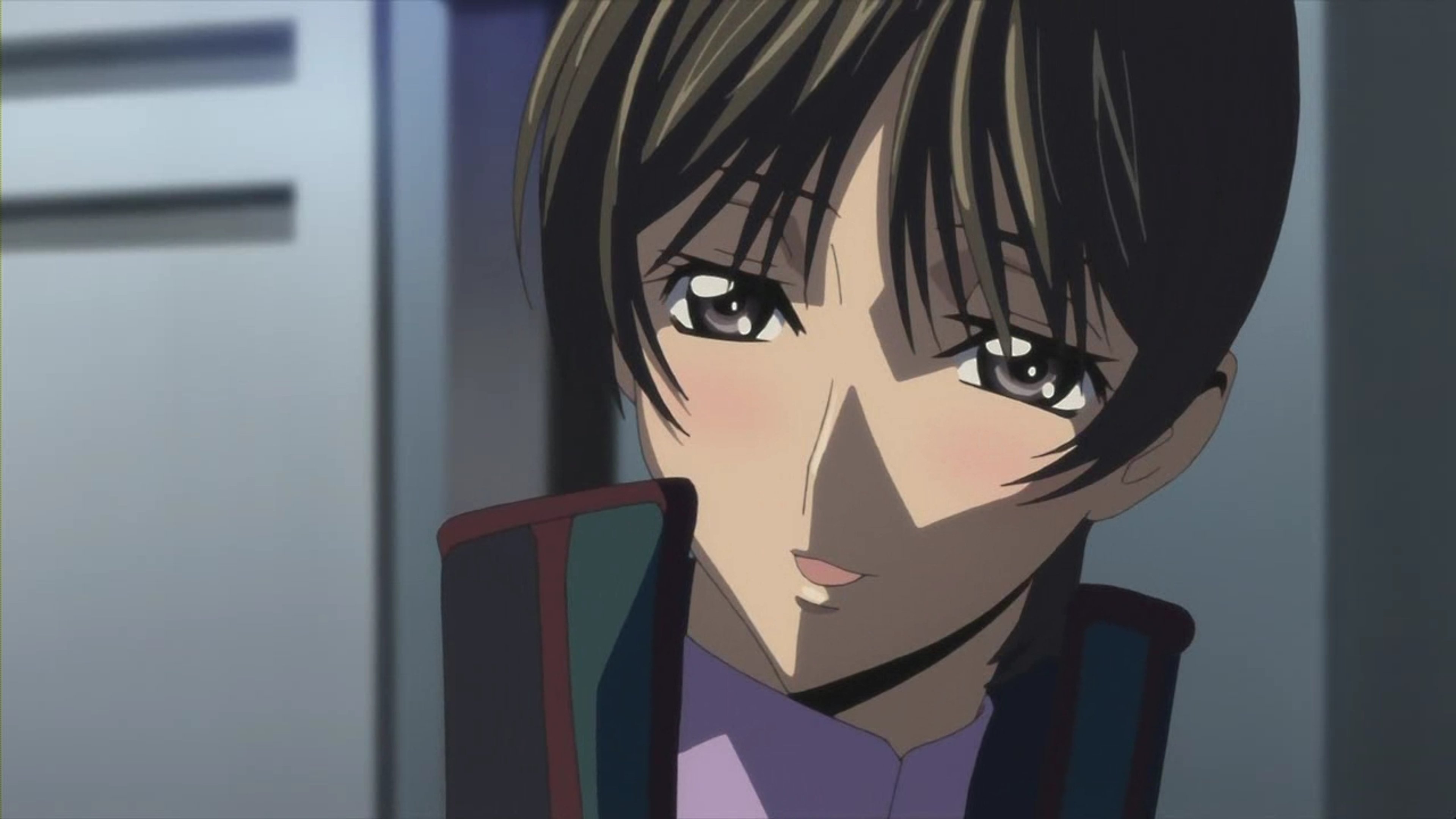 A young woman in a military uniform with a serious expression