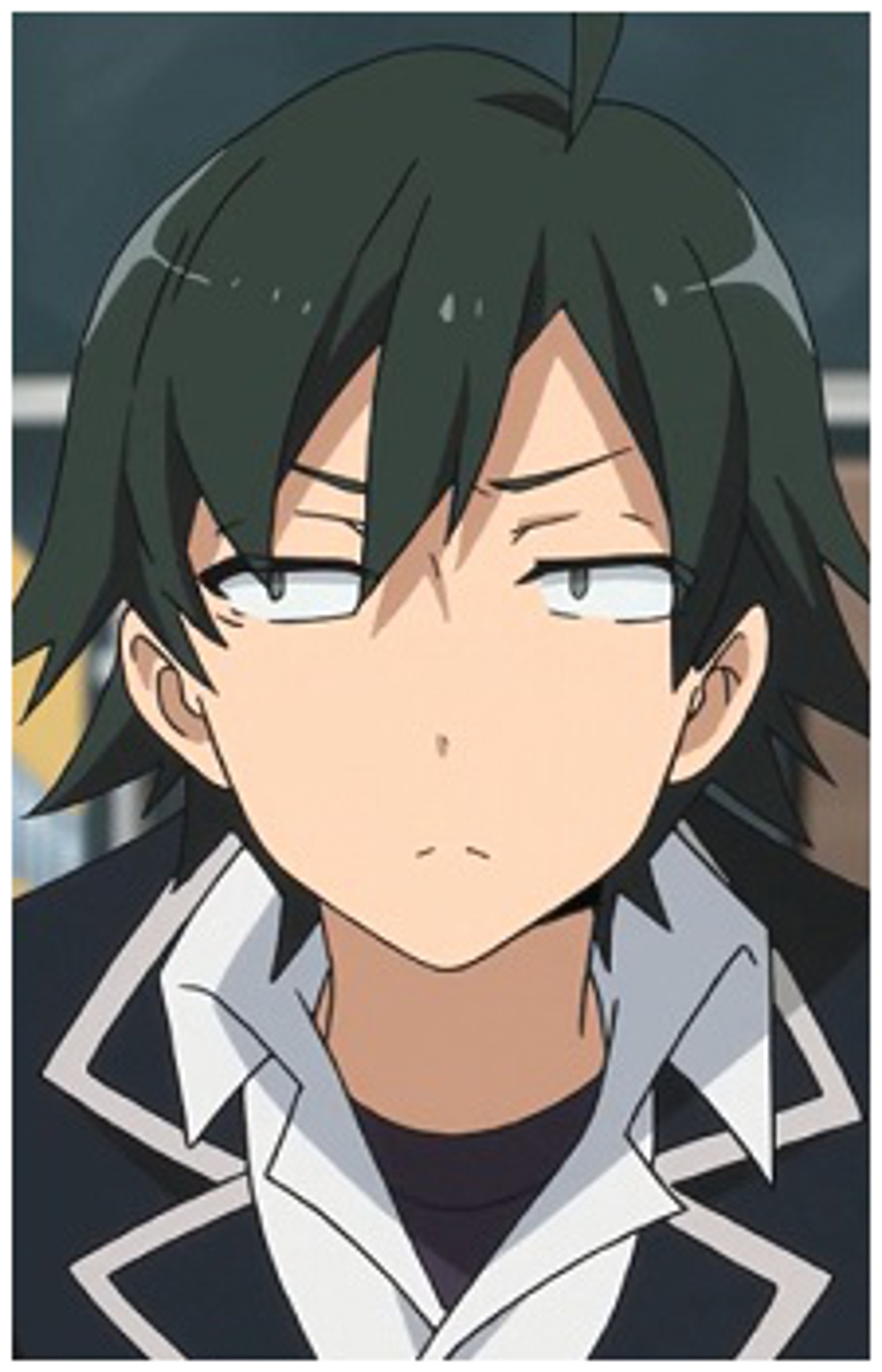 A young man with dark hair and a serious expression, wearing a white collared shirt.