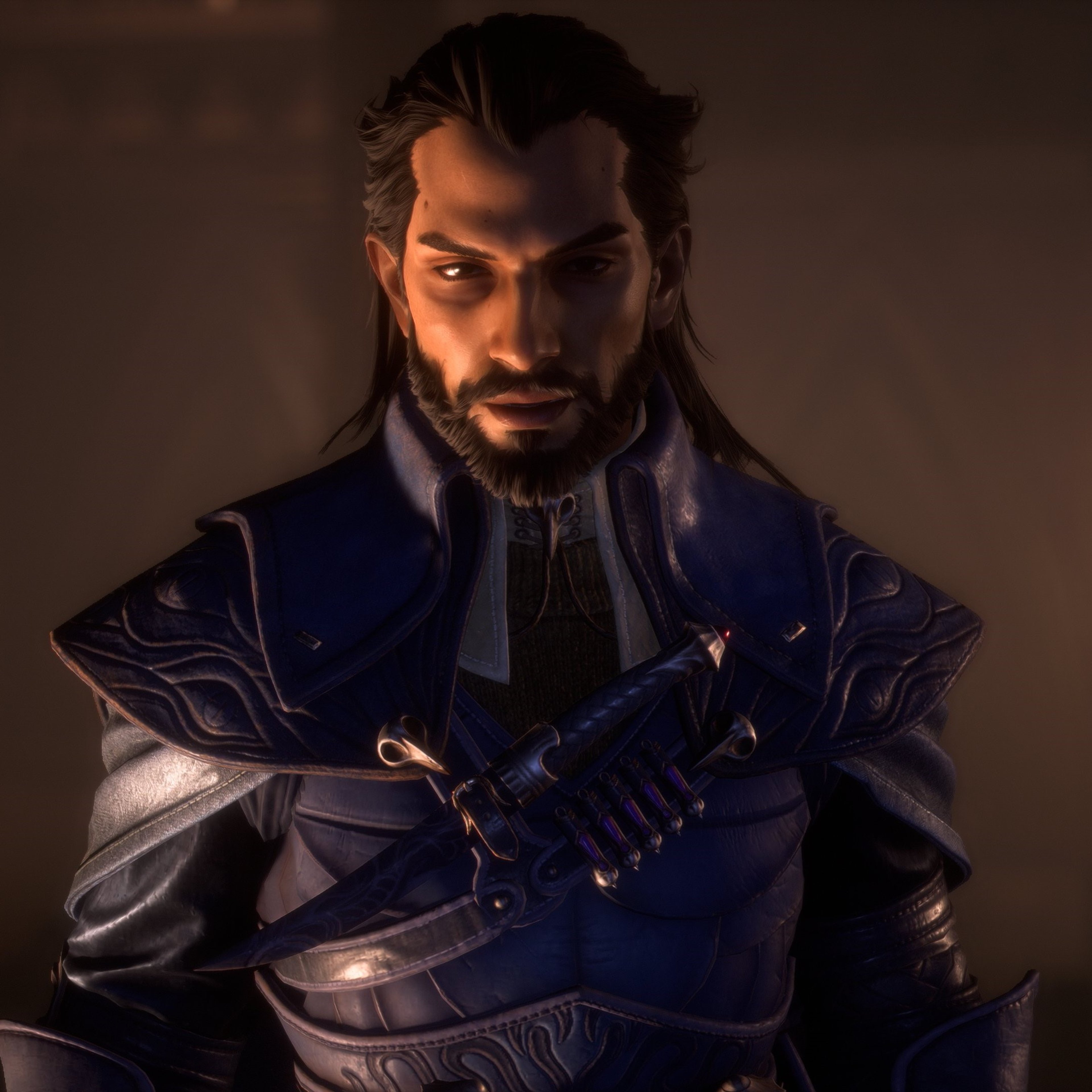 A man with long dark hair and a beard, wearing a dark blue coat and holding a weapon or tool.