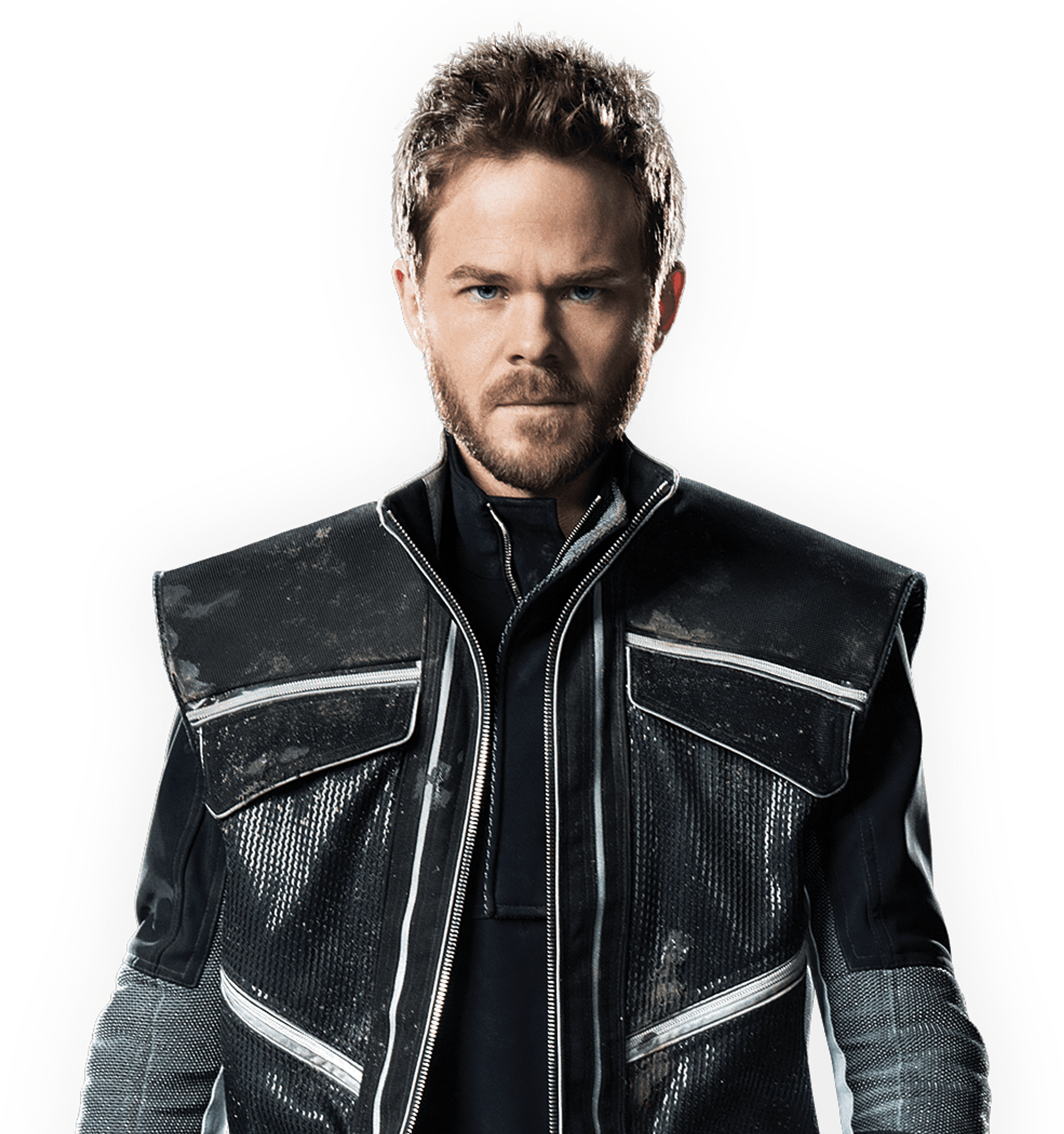 A close-up portrait of a young man with short brown hair and a beard, wearing a black leather jacket.