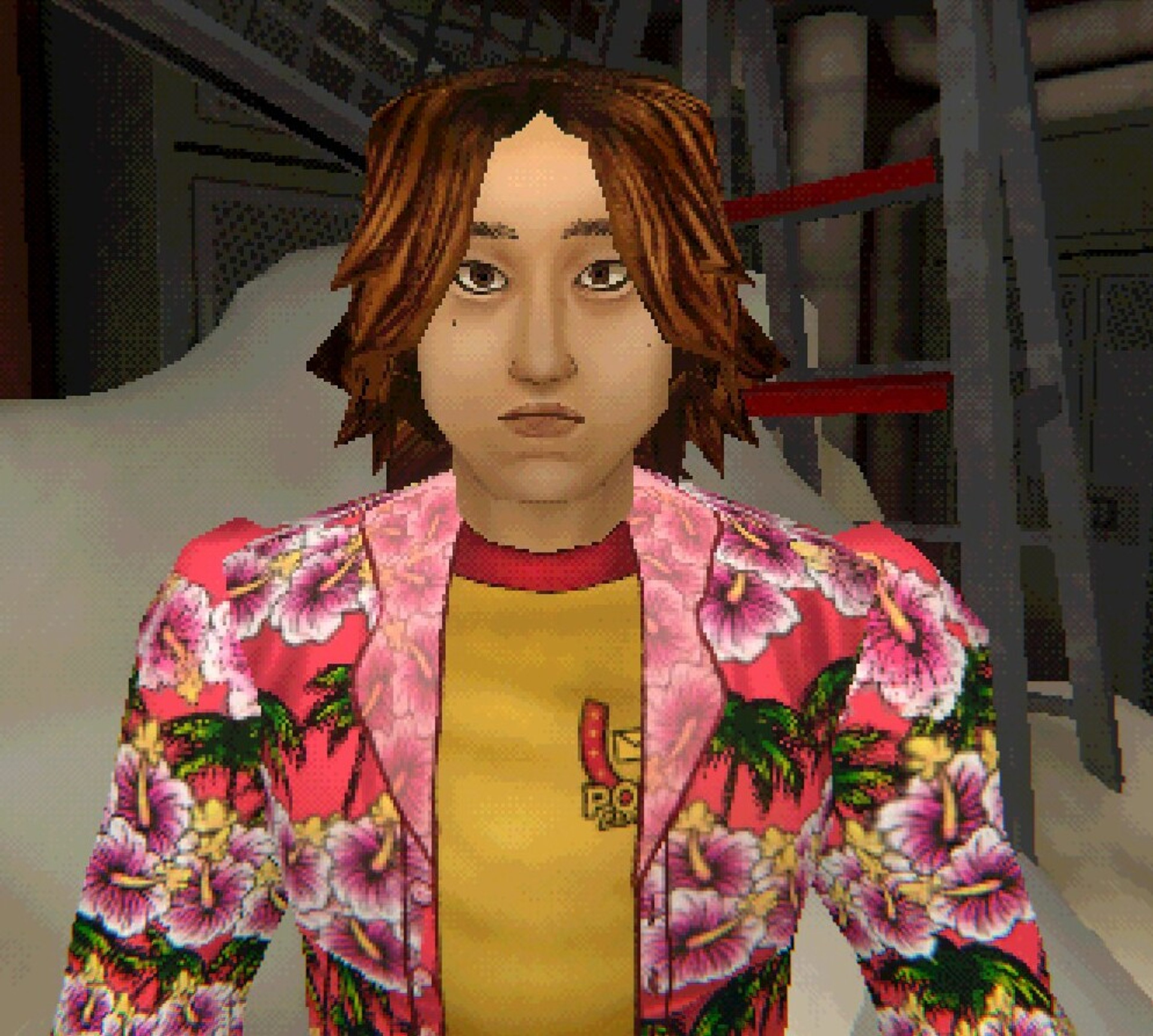 A young man with semi-dyed brown hair and almond-shaped brown eyes, wearing a yellow and red Pony Express ringer tee, a pink hibiscus patterned button-up shirt, blue jeans, and black boots.
