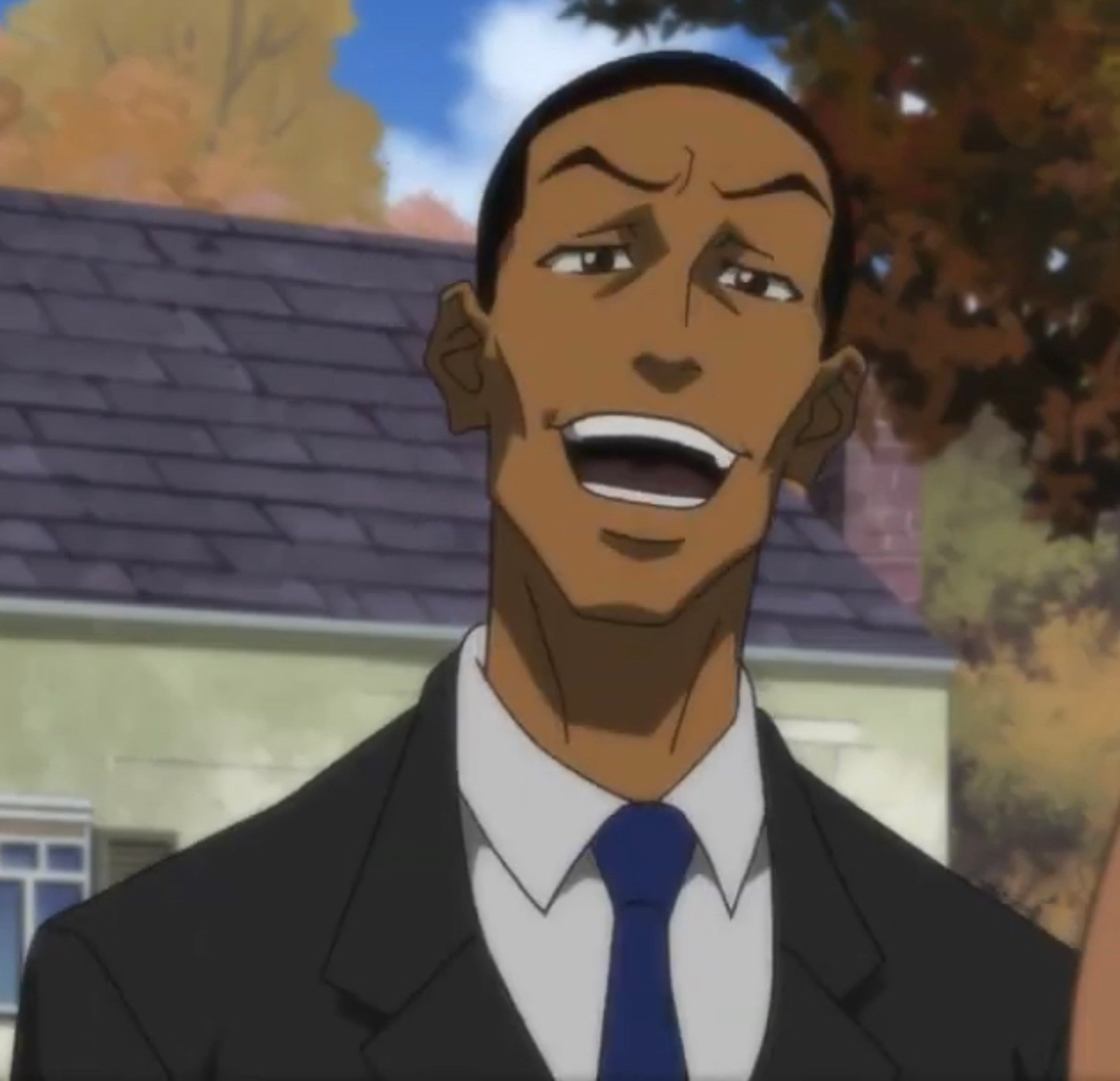 A middle-aged Black man in a suit and tie