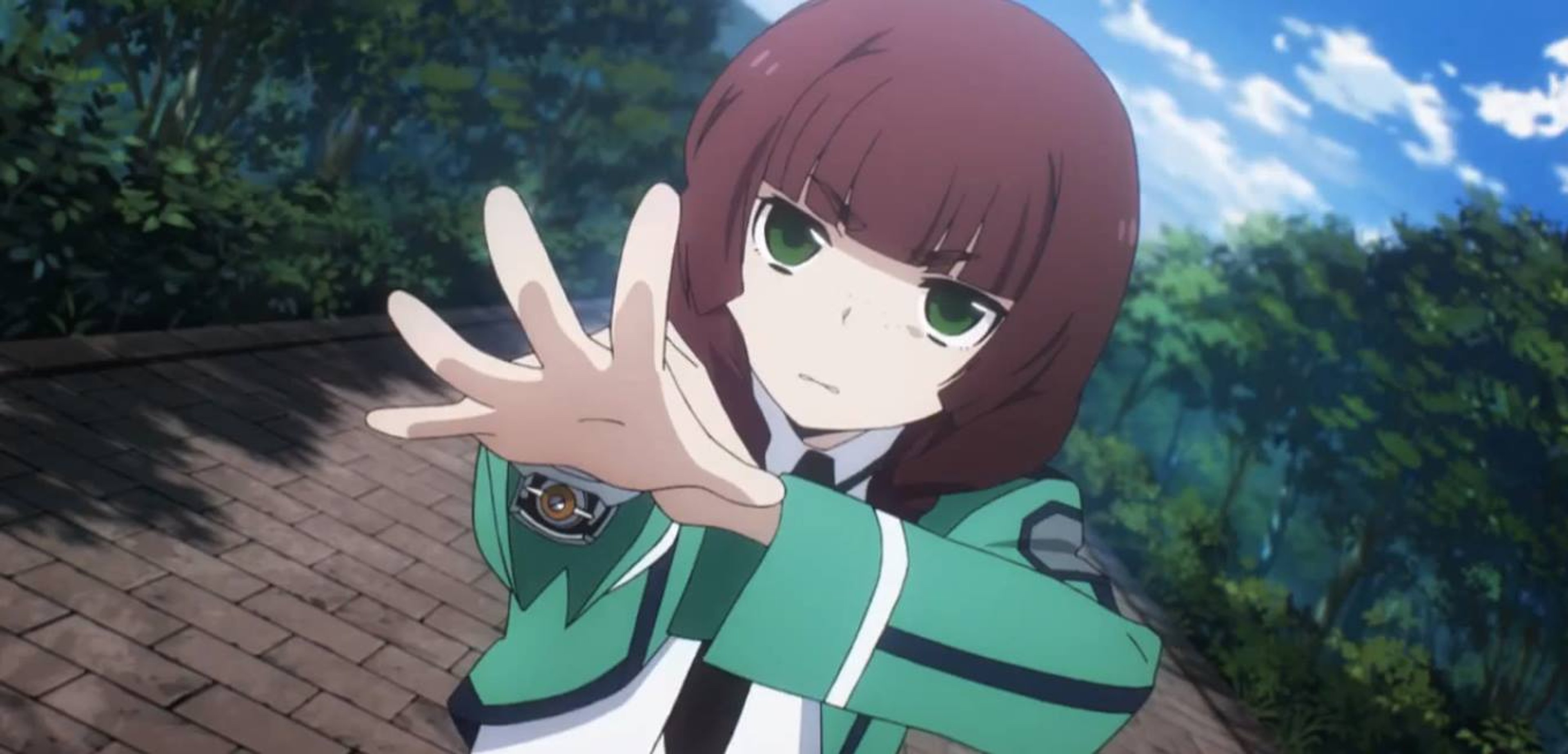 A young woman in a green school uniform with a serious expression