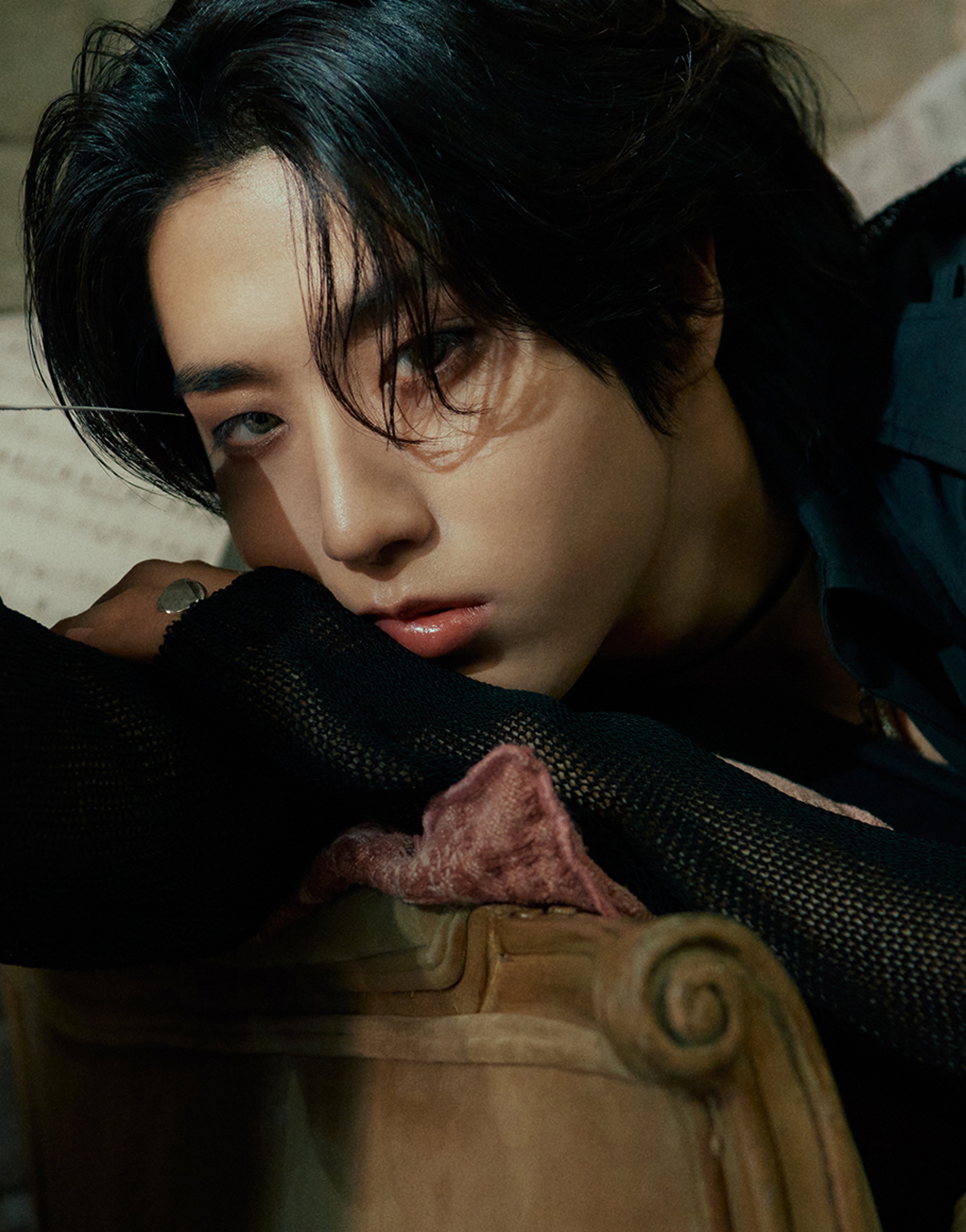 Close-up portrait of a young Asian man with a serious expression