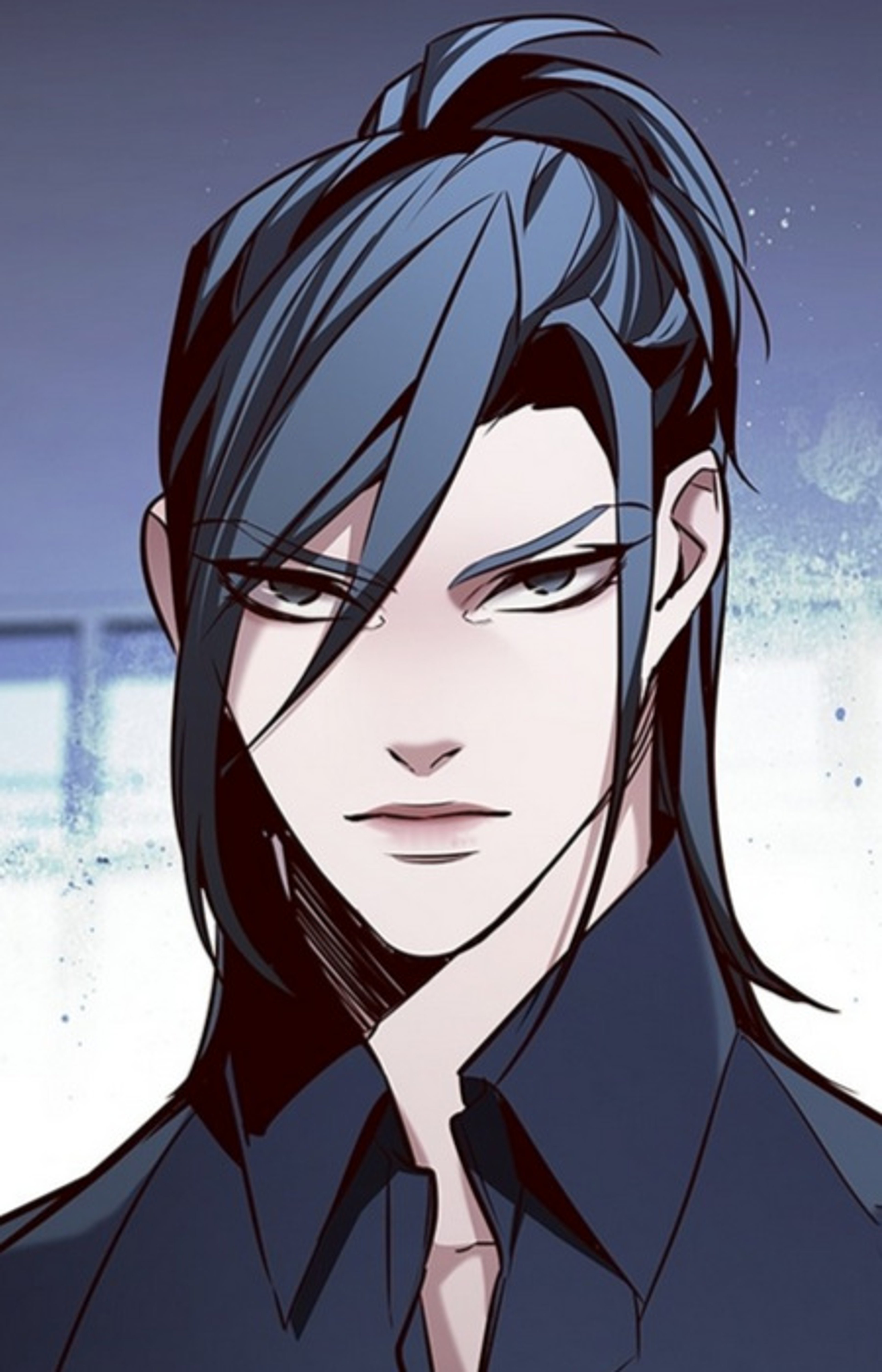 A handsome, powerful young man with long dark hair and piercing grey eyes