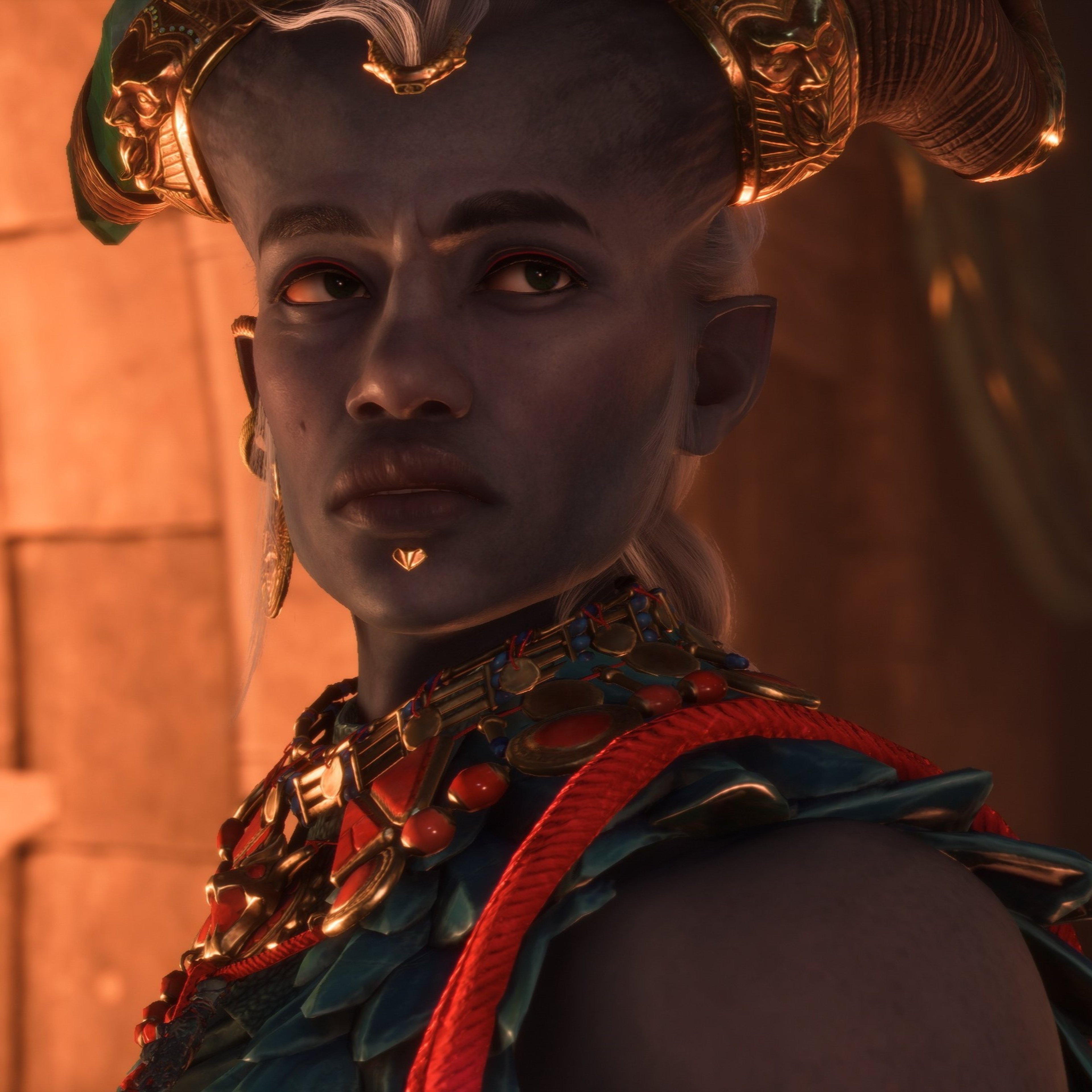 A Qunari character in ornate red and gold armor, wielding dual axes