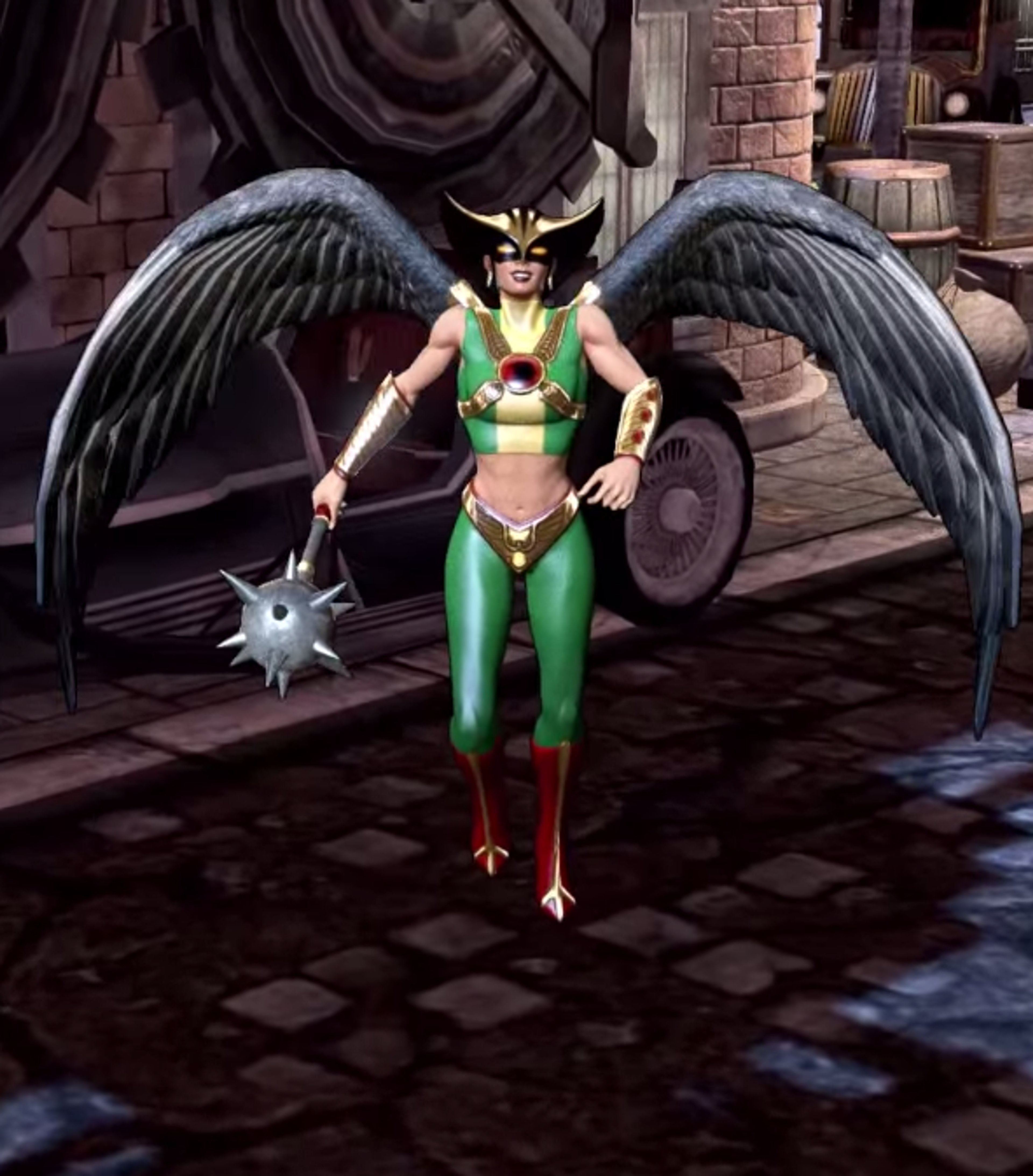 A female superhero character with large black wings, a green and red costume, and a mace-like weapon.