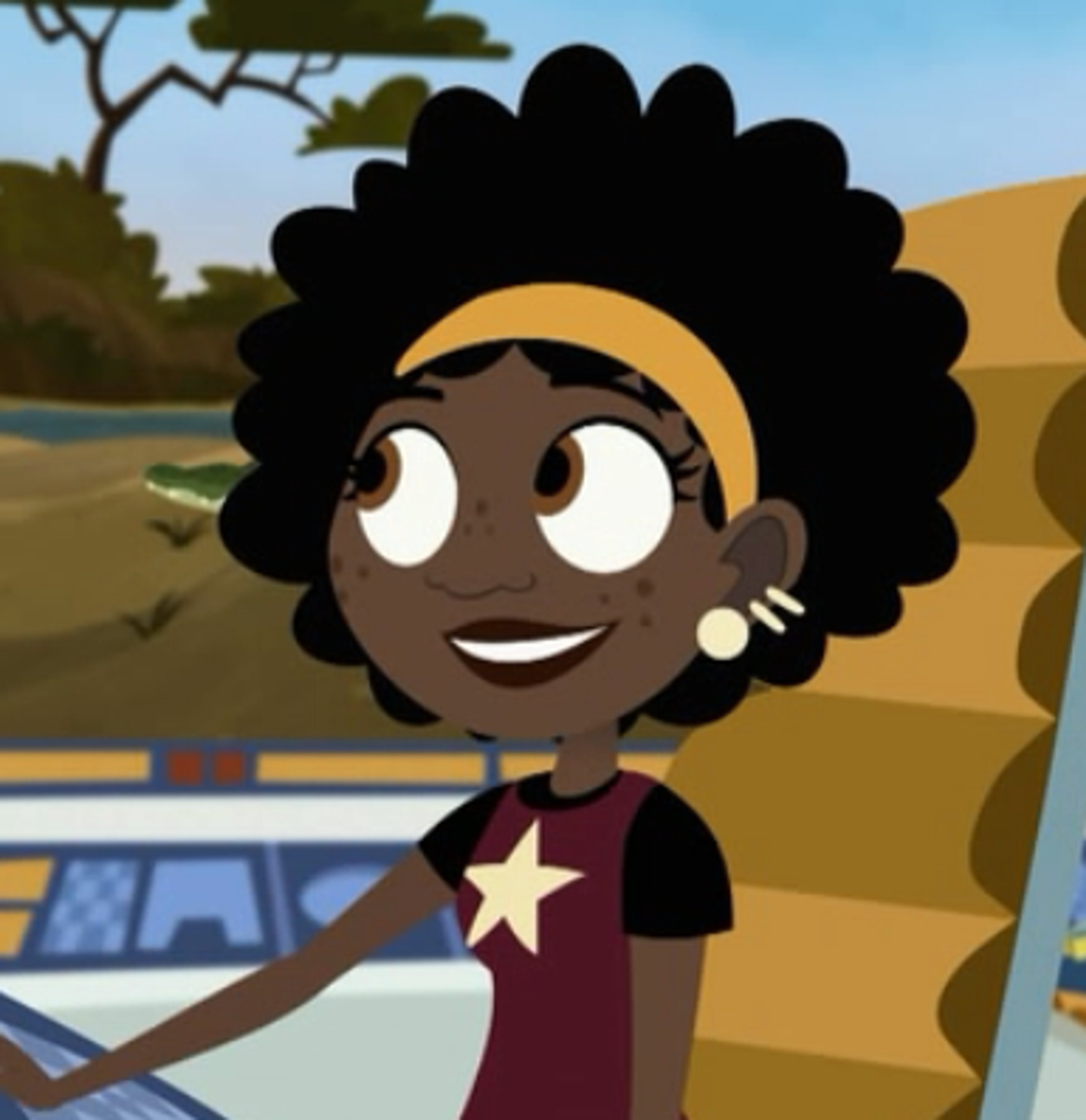 An animated character named Koki, a young Black woman with curly hair wearing an orange uniform