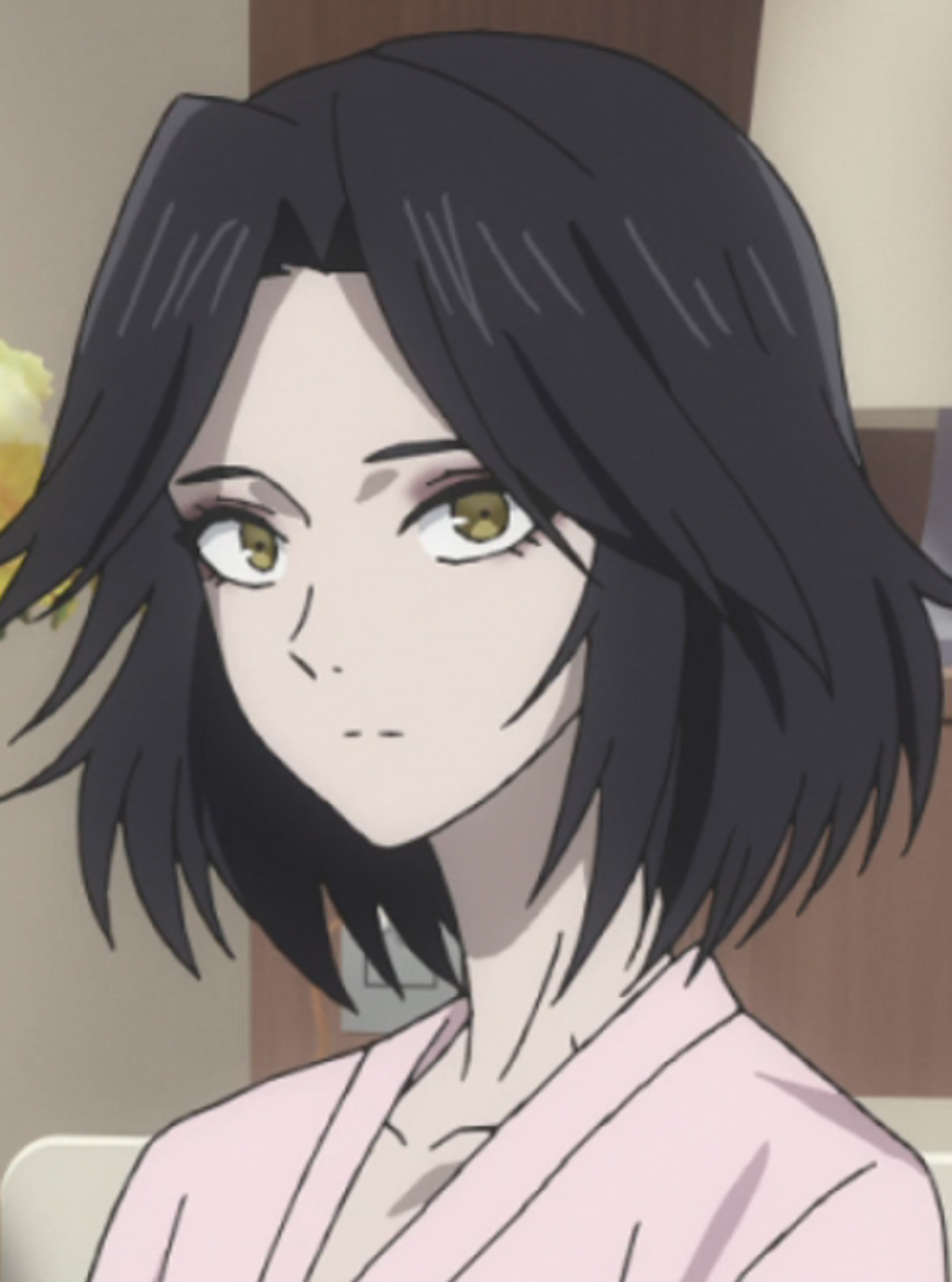 A young woman with short dark hair and yellow eyes, with a calm but intense expression.
