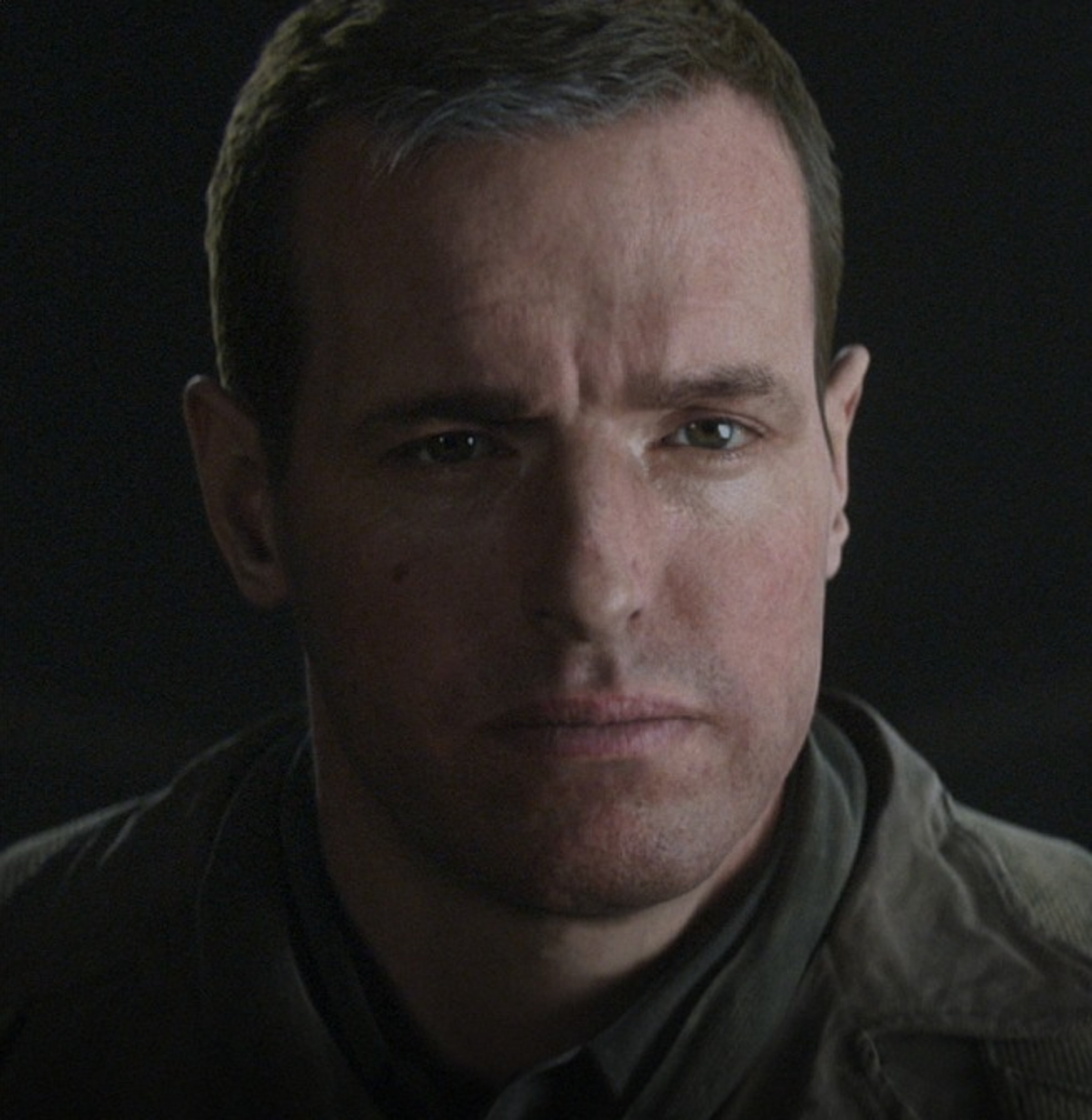 A serious-looking military officer in uniform