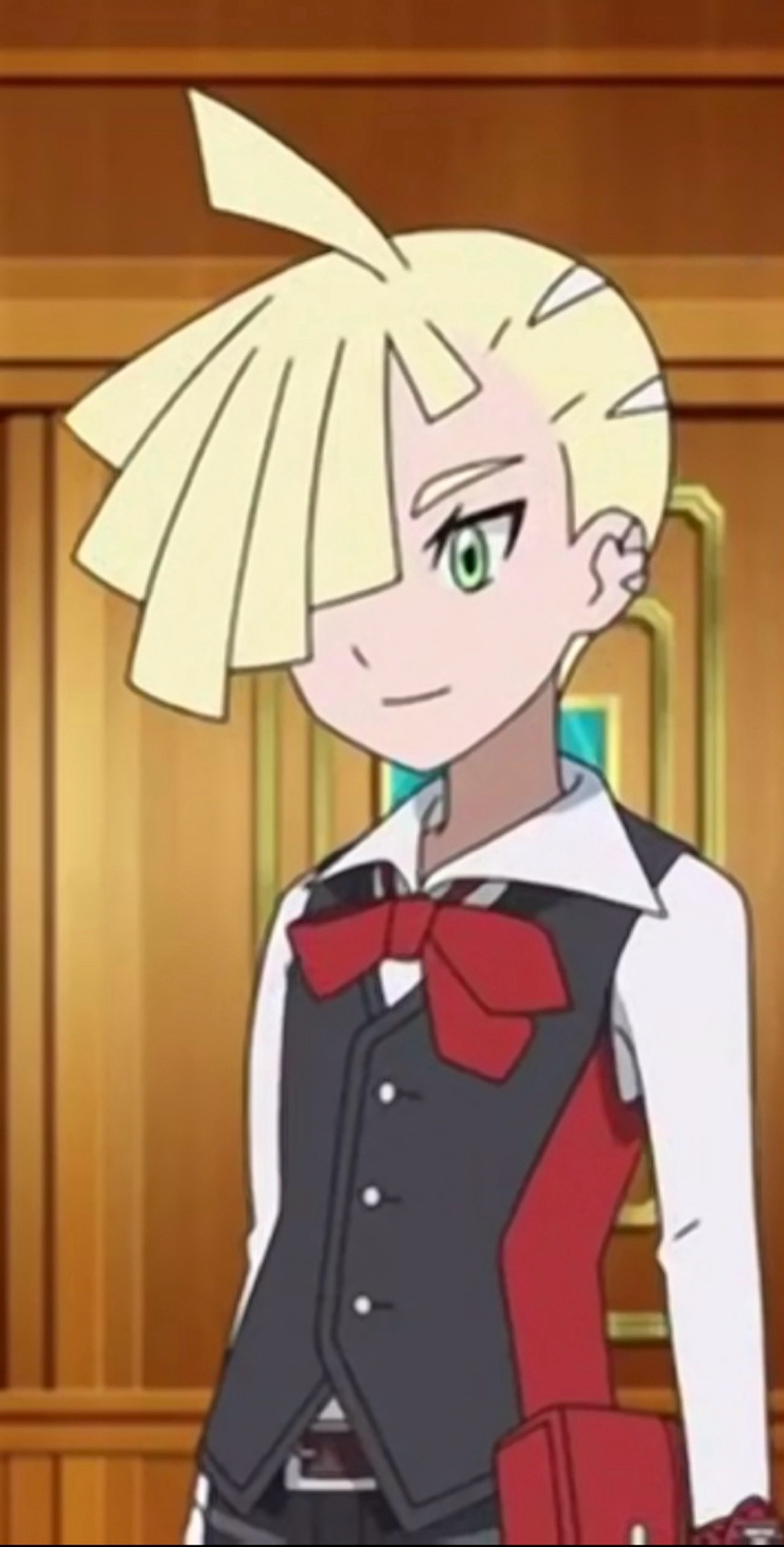 An anime-style character with blonde, spiky hair wearing a black suit with a red bow tie.