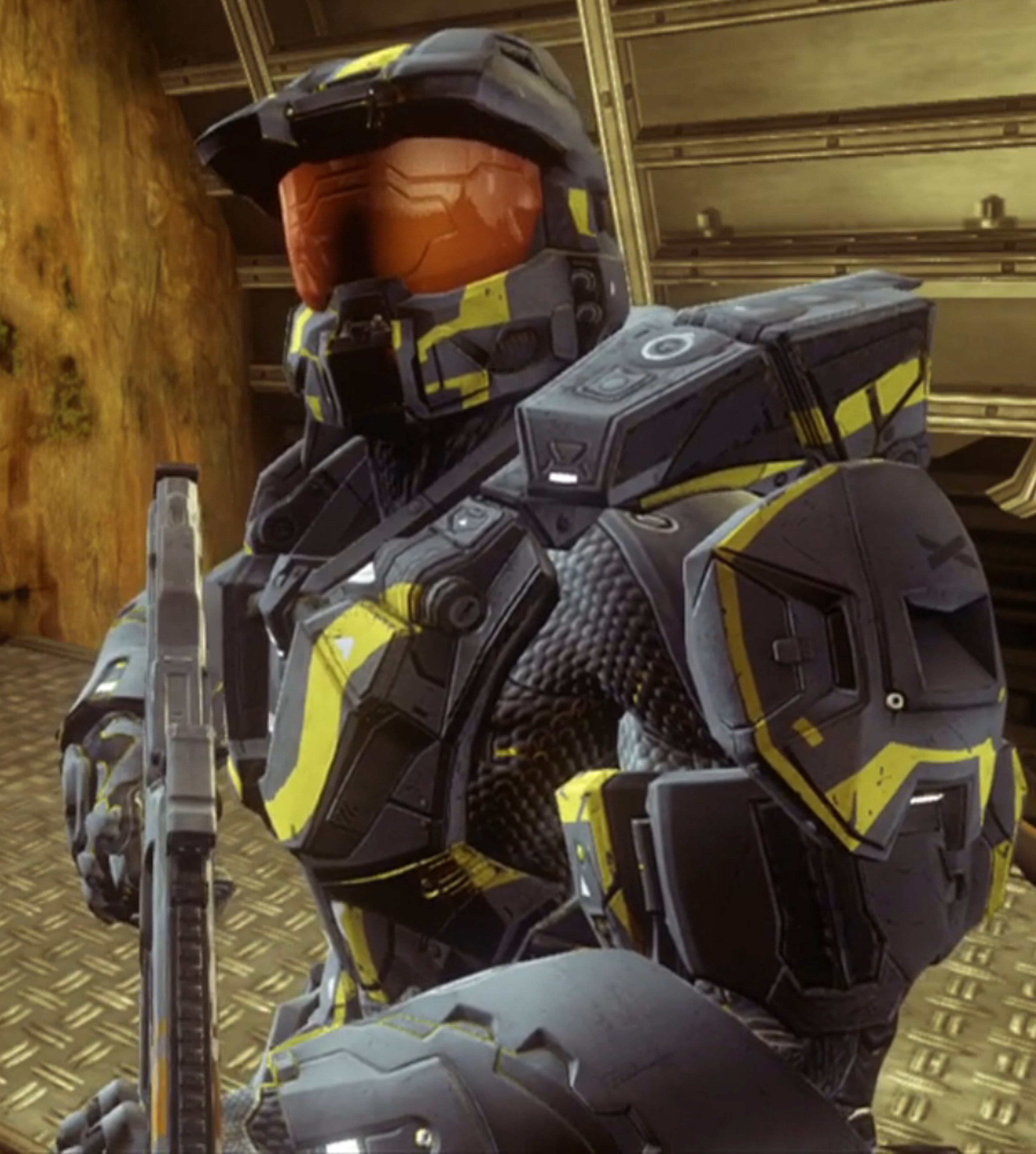 A heavily armored military character in a black and yellow suit of armor, holding a large weapon.